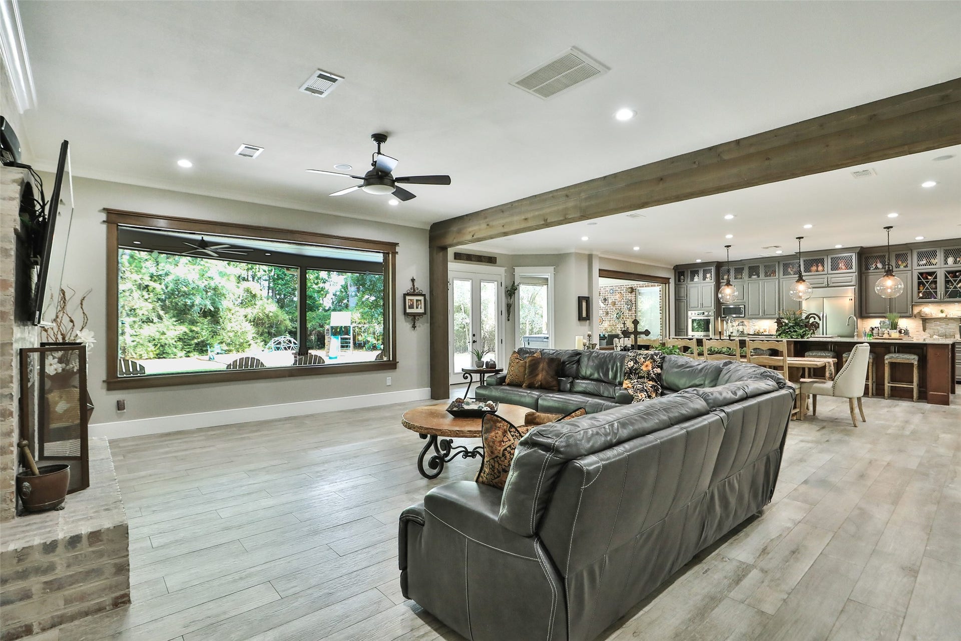 Look at this great living space with picture windows to view the back of the beautiful property.