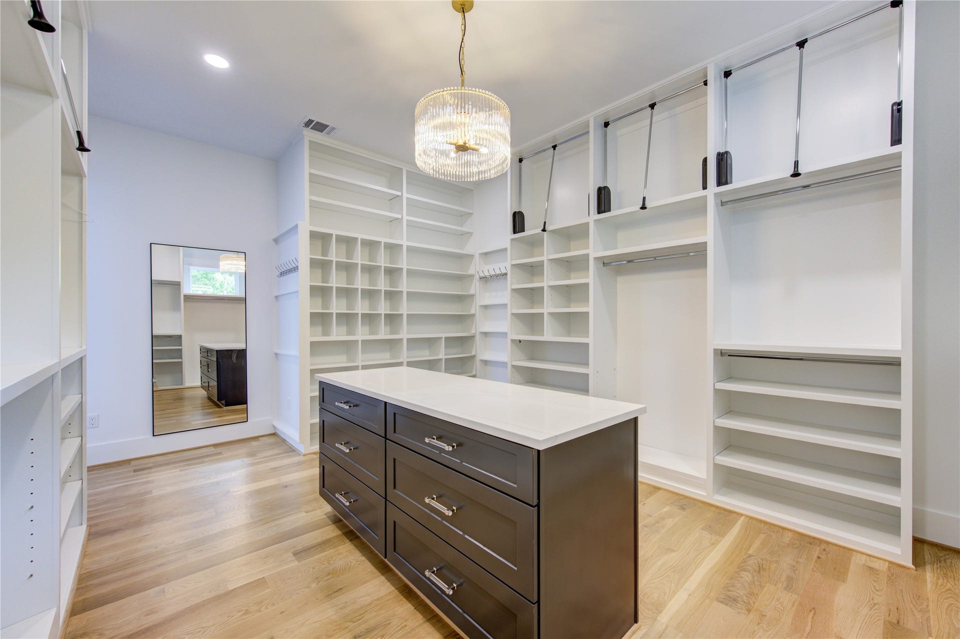 Large Drawers with countertop under the beautiful chandelier. Window to grace the morning sunshine.