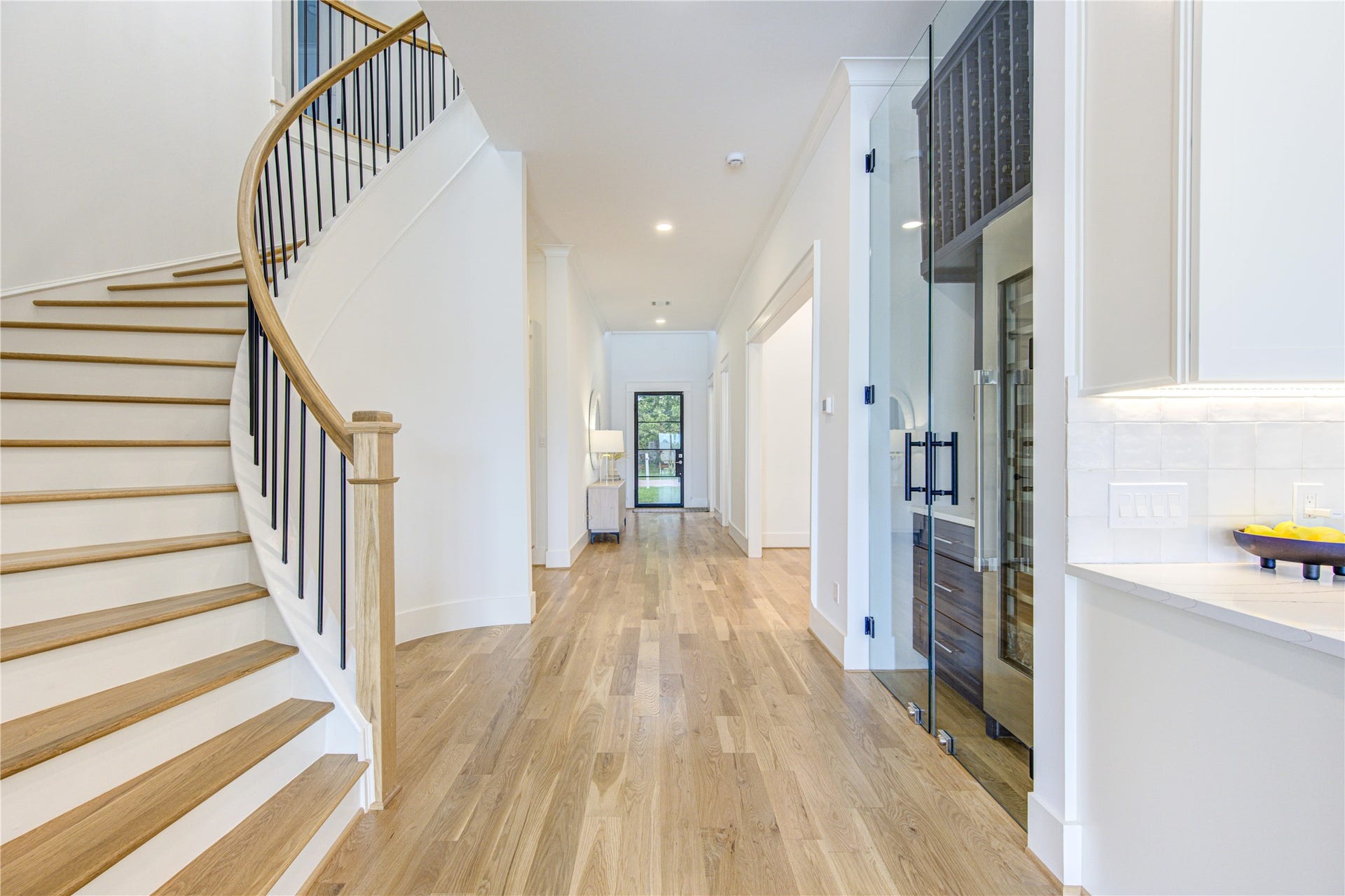 All Solid Hardwood Floor (White Oak), Beautifully crafted Circular Stair, Wide Hallway, High Ceiling.