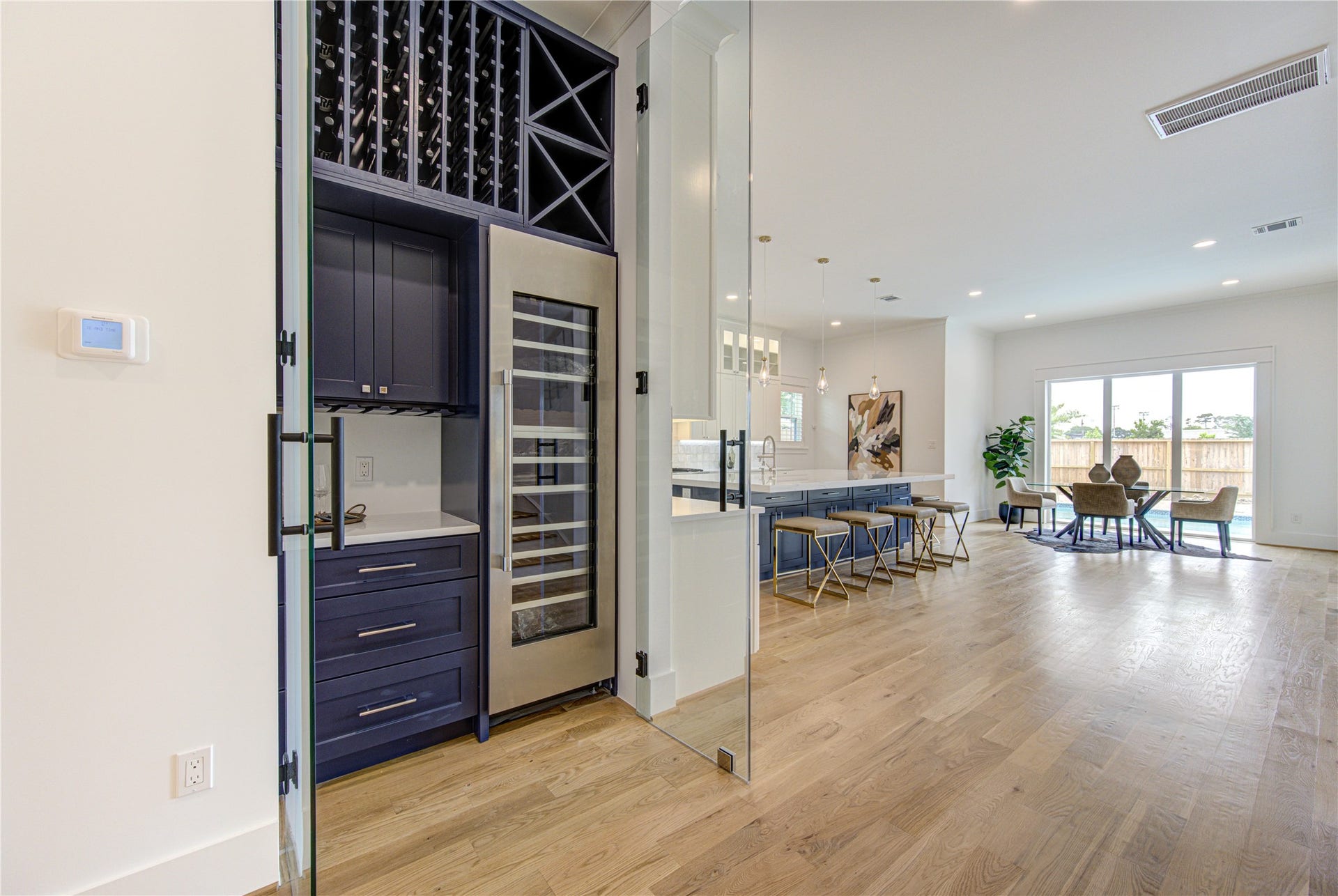 Exquisite Wine Station w/ Thermador 92-bottle Wine Cooler and rack for all bottle sizes - all in lockable Glass Enclosure.