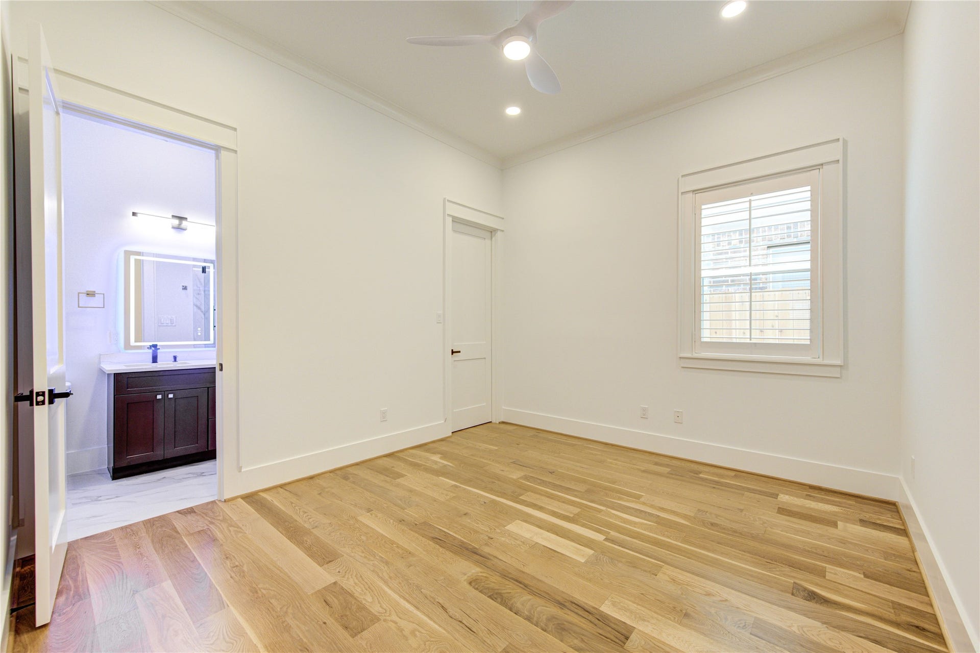 Guest Suite across the hallway from the Dining. All bedrooms have Plantation Window Shutters.