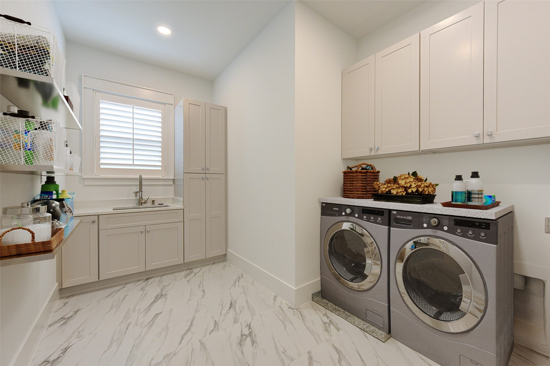 Laundry room with bunch of storages.