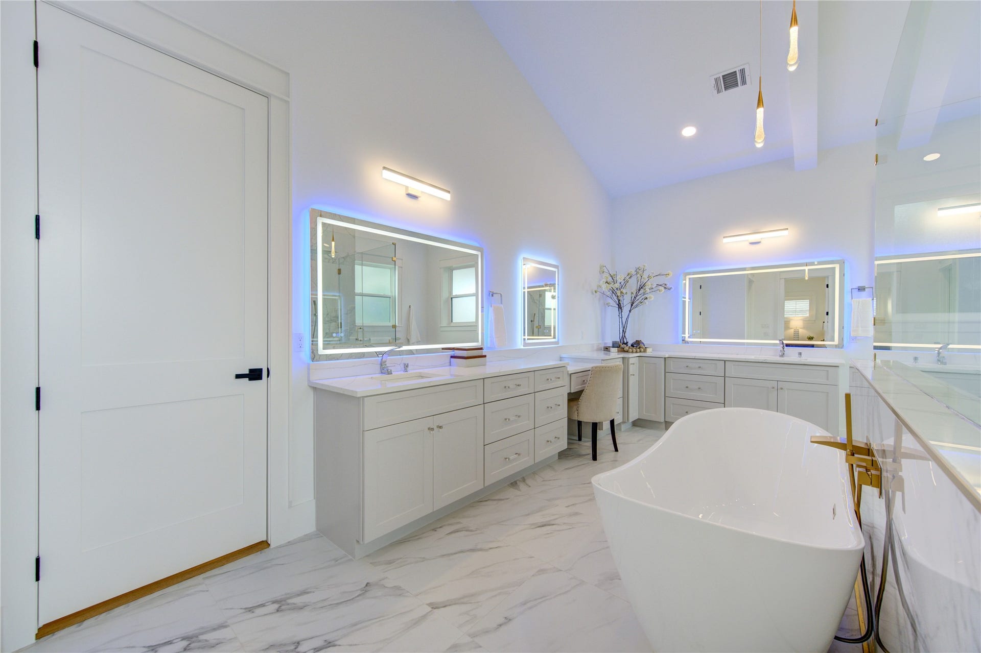3 Colorful LED Mirrors which can be set to any color for the Backlit and Front and anti-Fog feature. Door leads to Closet.