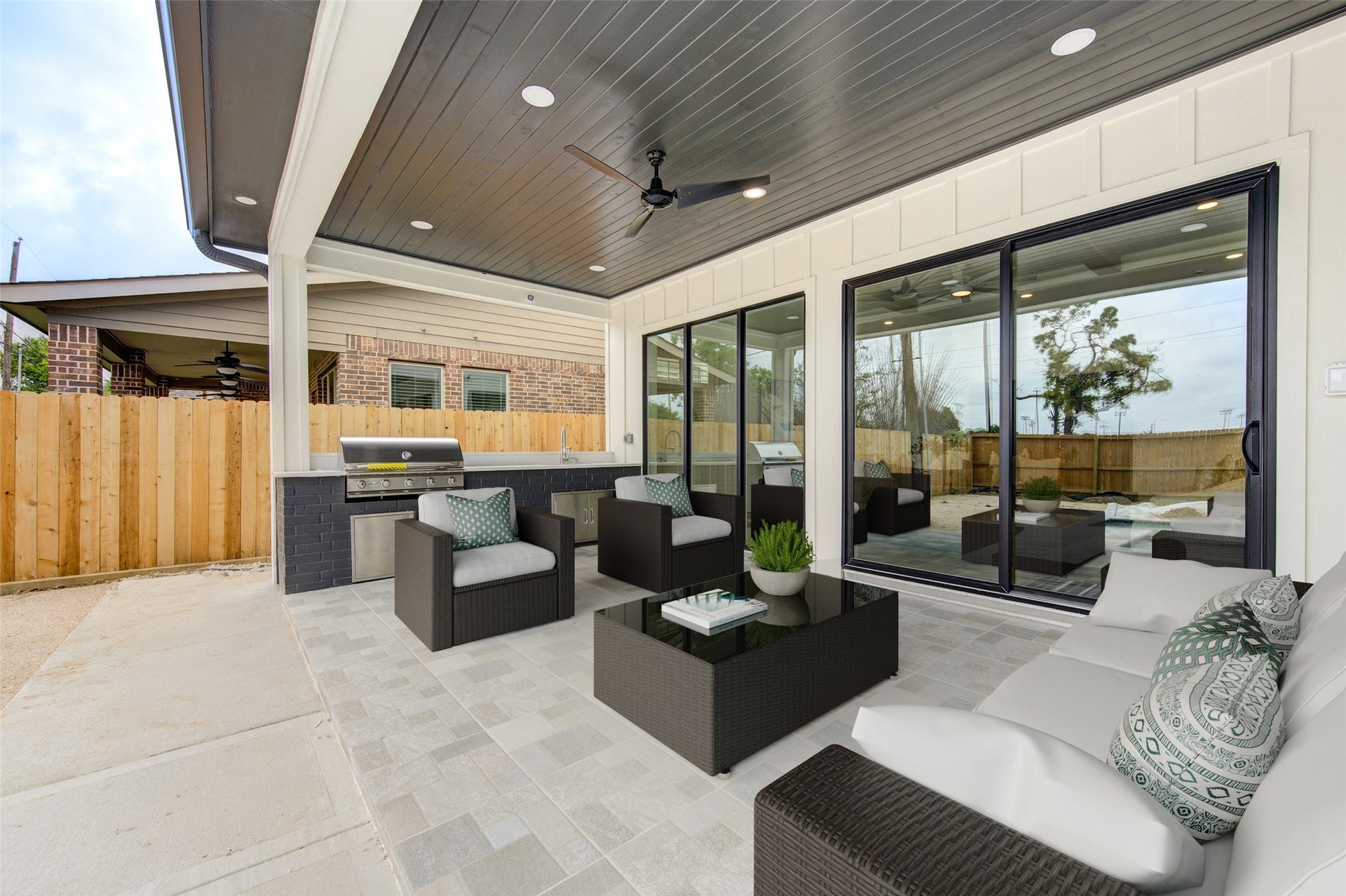 Large windows between Living room and Patio.