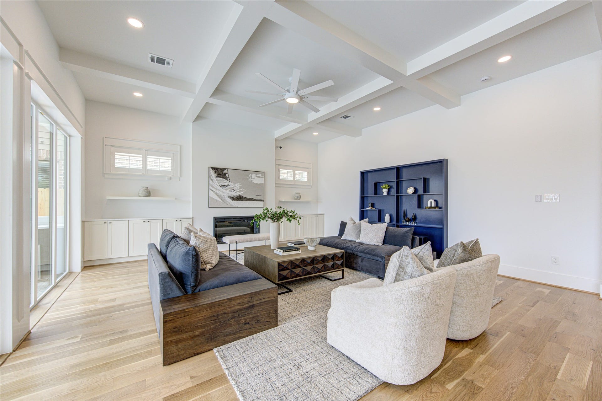 Texas-Size Living room with Coffered Ceiling and bunch of Built-ins. 8ft wide TV space for even the largest TV of tomorrow.
