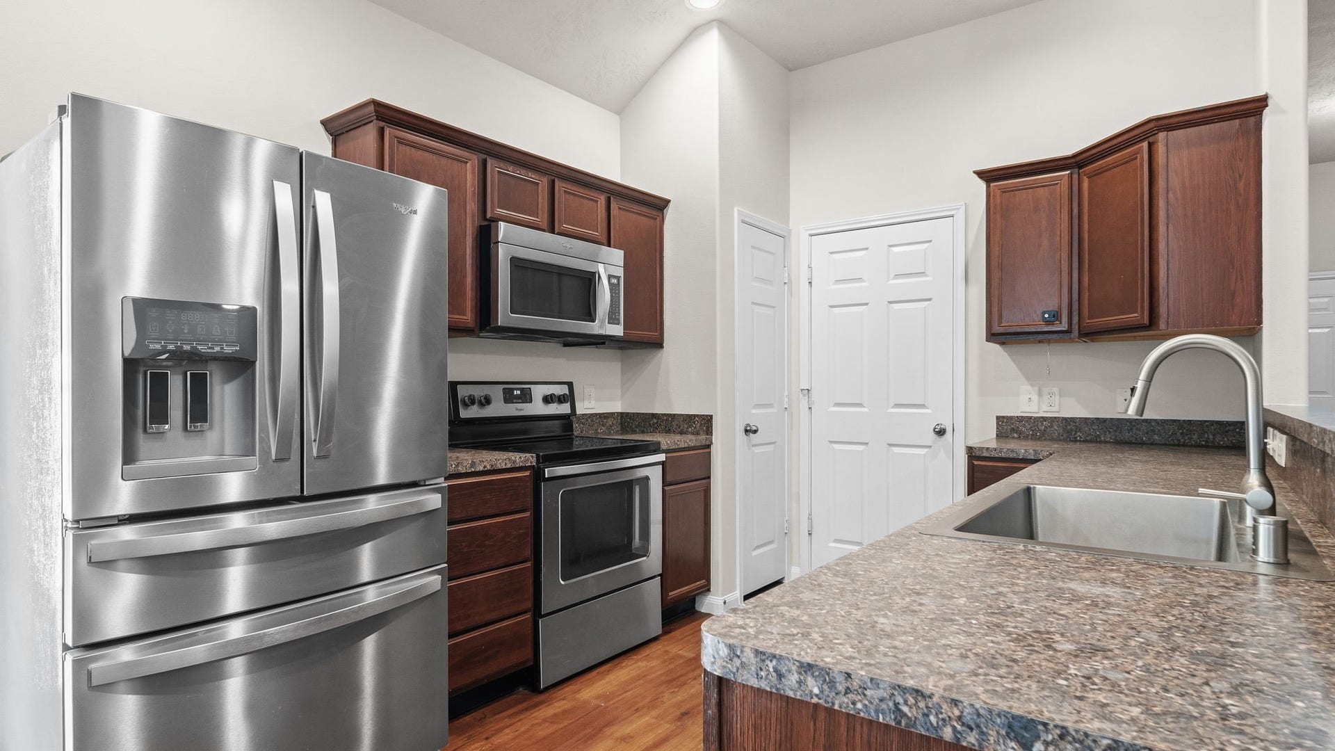 11246 Glenforest Drive, Montgomery, TX 77356 Enjoy cooking in this well-equipped kitchen featuring stainless steel appliances, rich wood cabinetry, generous counter space, and a convenient breakfast bar.