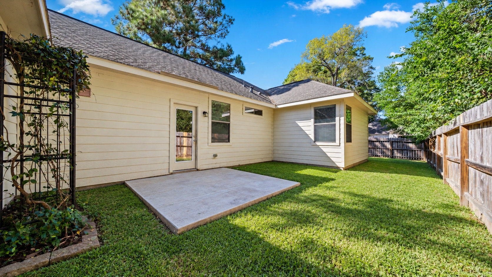 11246 Glenforest Drive, Montgomery, TX 77356 Step outside to your own fully fenced backyard with an open patio, perfect for morning coffee, outdoor dining, or relaxing after a busy day.