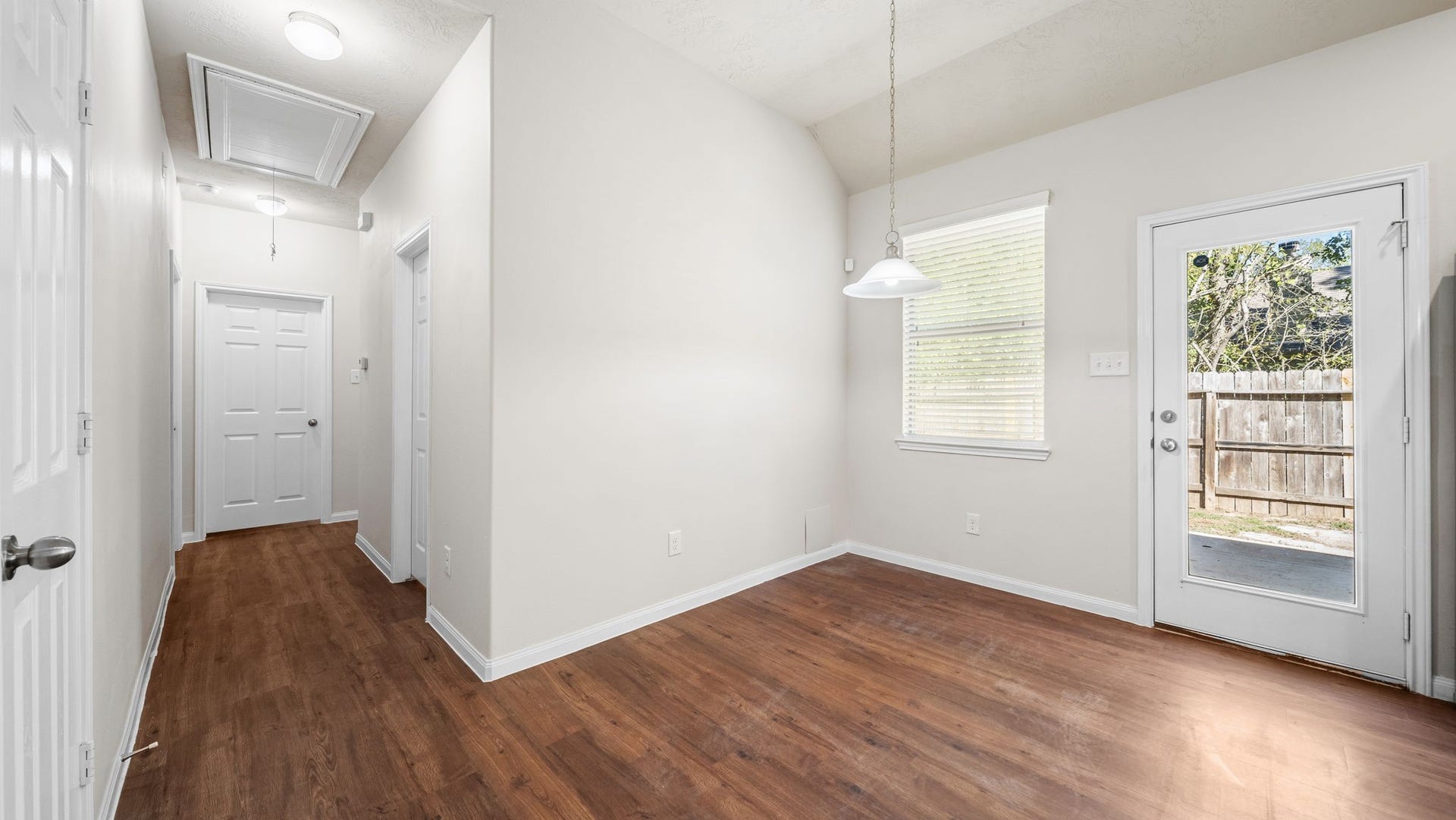 11246 Glenforest Drive, Montgomery, TX 77356 Enjoy a dedicated dining area filled with natural light and convenient backyard access, making indoor-outdoor living effortless.