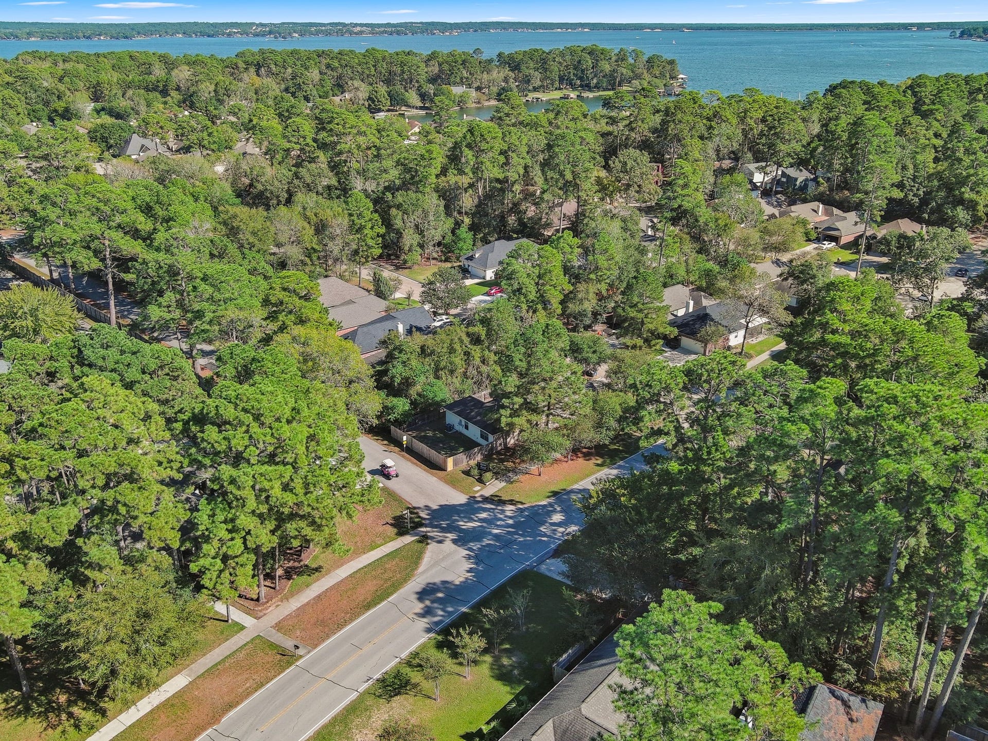 11246 Glenforest Drive, Montgomery, TX 77356 Enjoy the extra breathing room of this spacious, tree-shaded corner lot, offering attractive landscaping, a generous yard, and a desirable setting in Walden on Lake Conroe.