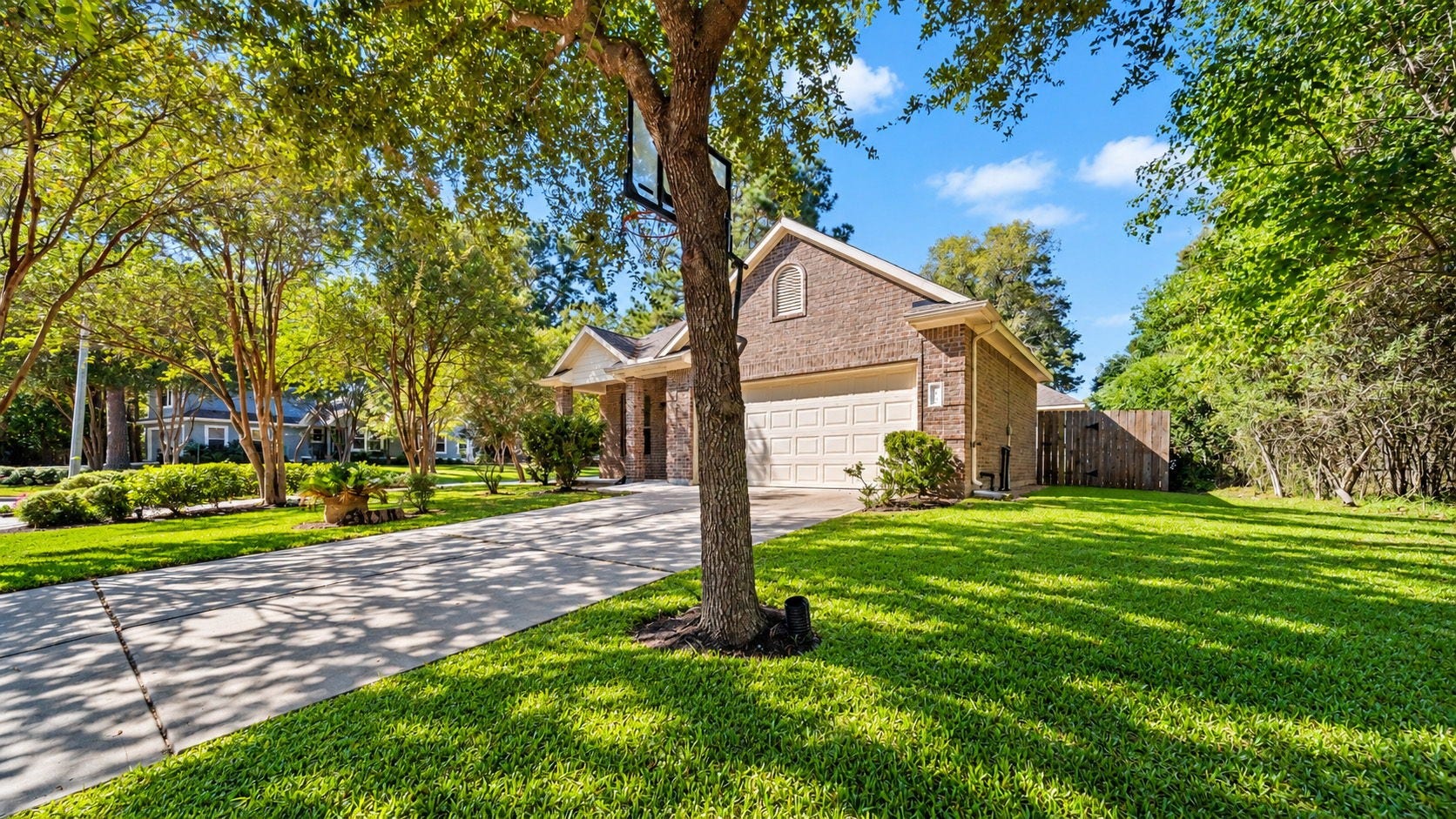 11246 Glenforest Drive, Montgomery, TX 77356 Enjoy the inviting setting of this attractive home featuring a two-car garage, generous driveway, and picturesque tree-shaded yard.