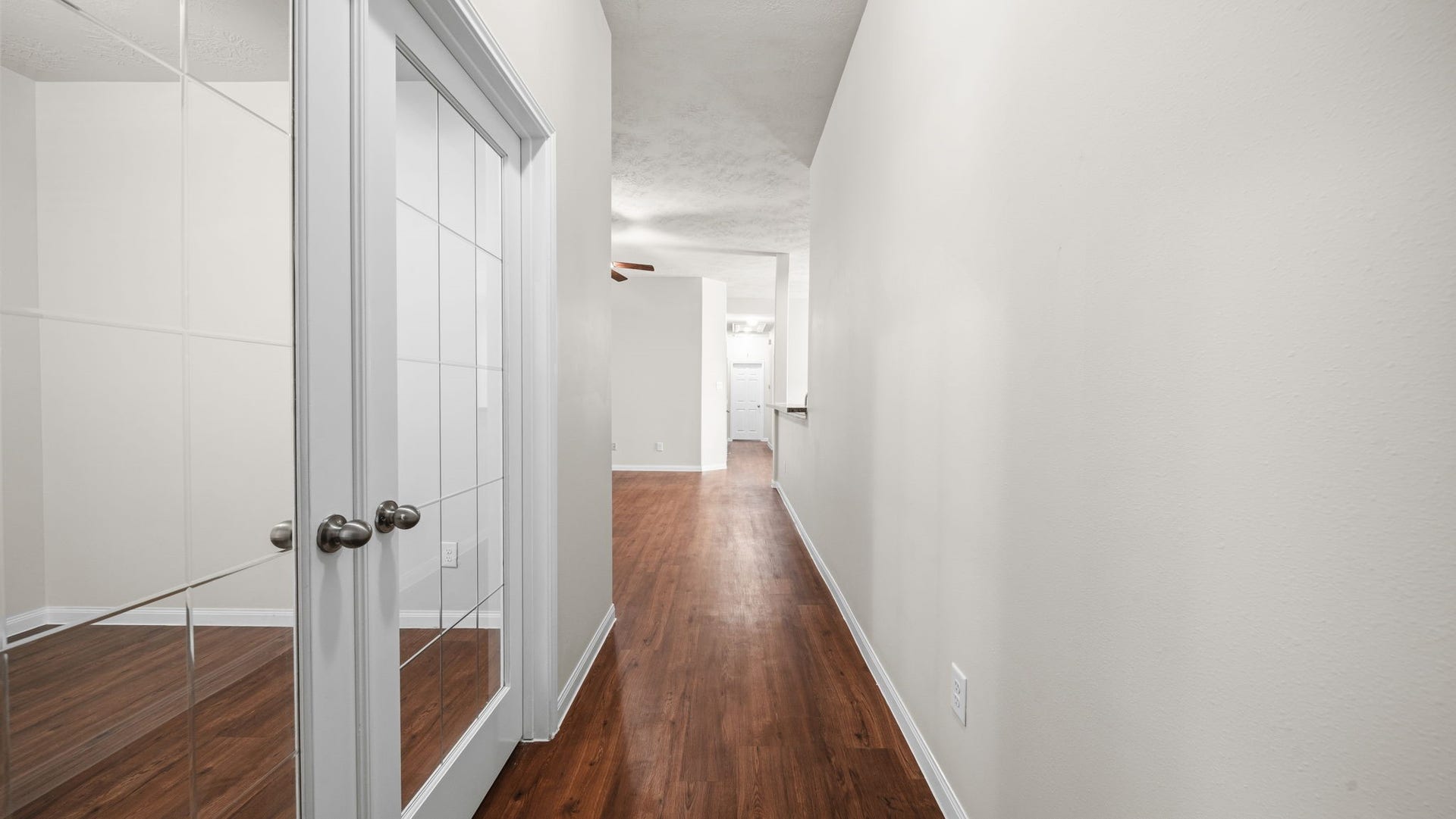 11246 Glenforest Drive, Montgomery, TX 77356 Thoughtfully designed interior with continuous wood-look flooring and charming glass-paneled French doors that add character to the home.