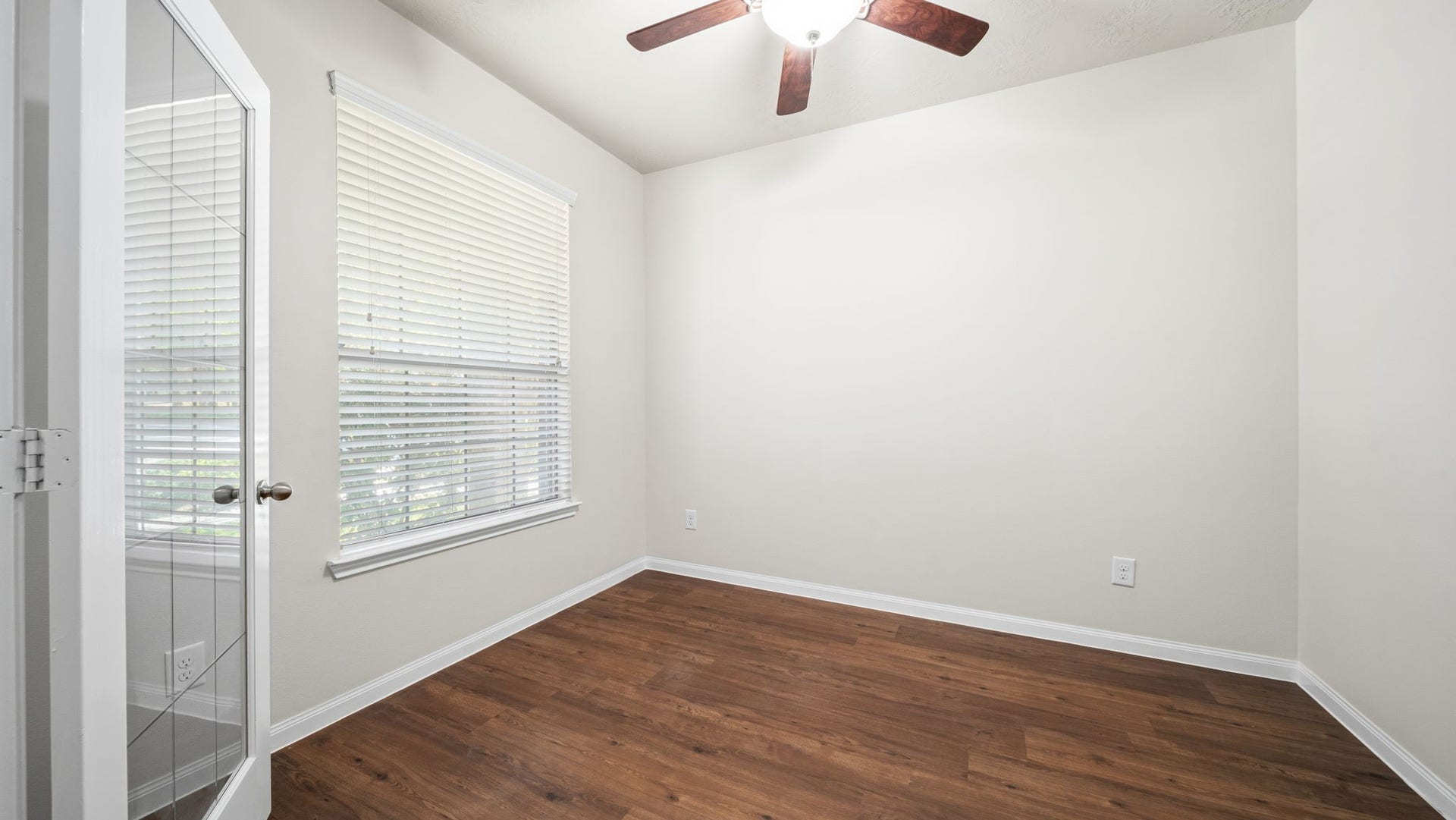 11246 Glenforest Drive, Montgomery, TX 77356 Create a space that fits your lifestyle! This inviting room offers natural light, attractive flooring, glass paneled French doors, and flexibility for a home office, workout space, or fourth bedroom.