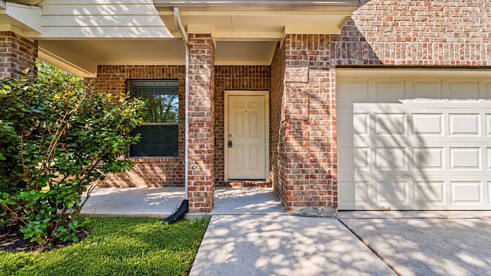 11246 Glenforest Drive, Montgomery, TX 77356 Step onto the welcoming covered front porch, a lovely spot to enjoy your morning coffee before heading out to explore everything Walden has to offer.