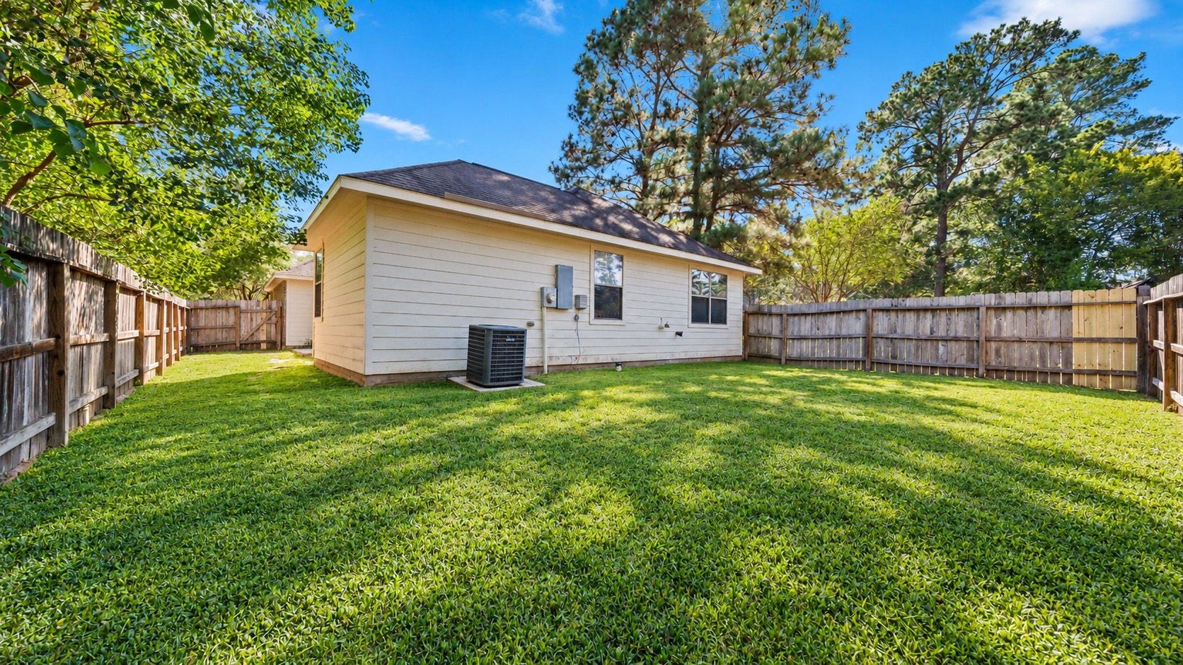 11246 Glenforest Drive, Montgomery, TX 77356 Enjoy outdoor living in this generously sized, fully fenced backyard with lush green grass and plenty of space to relax, play, or entertain.