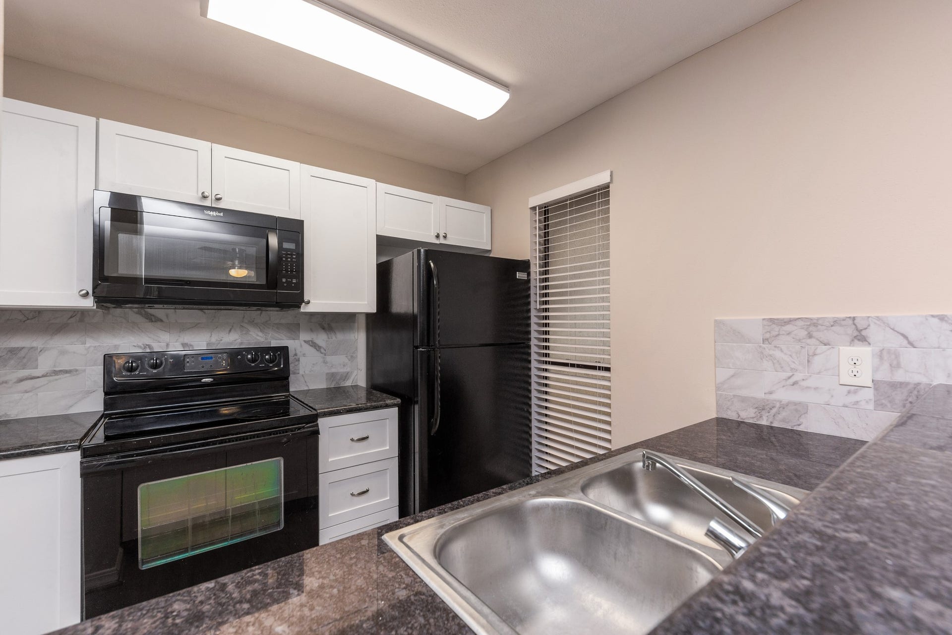 3500 Tangle Brush Drive, #132, The Woodlands, TX 77381 The granite countertops in this home are a wonderful feature.