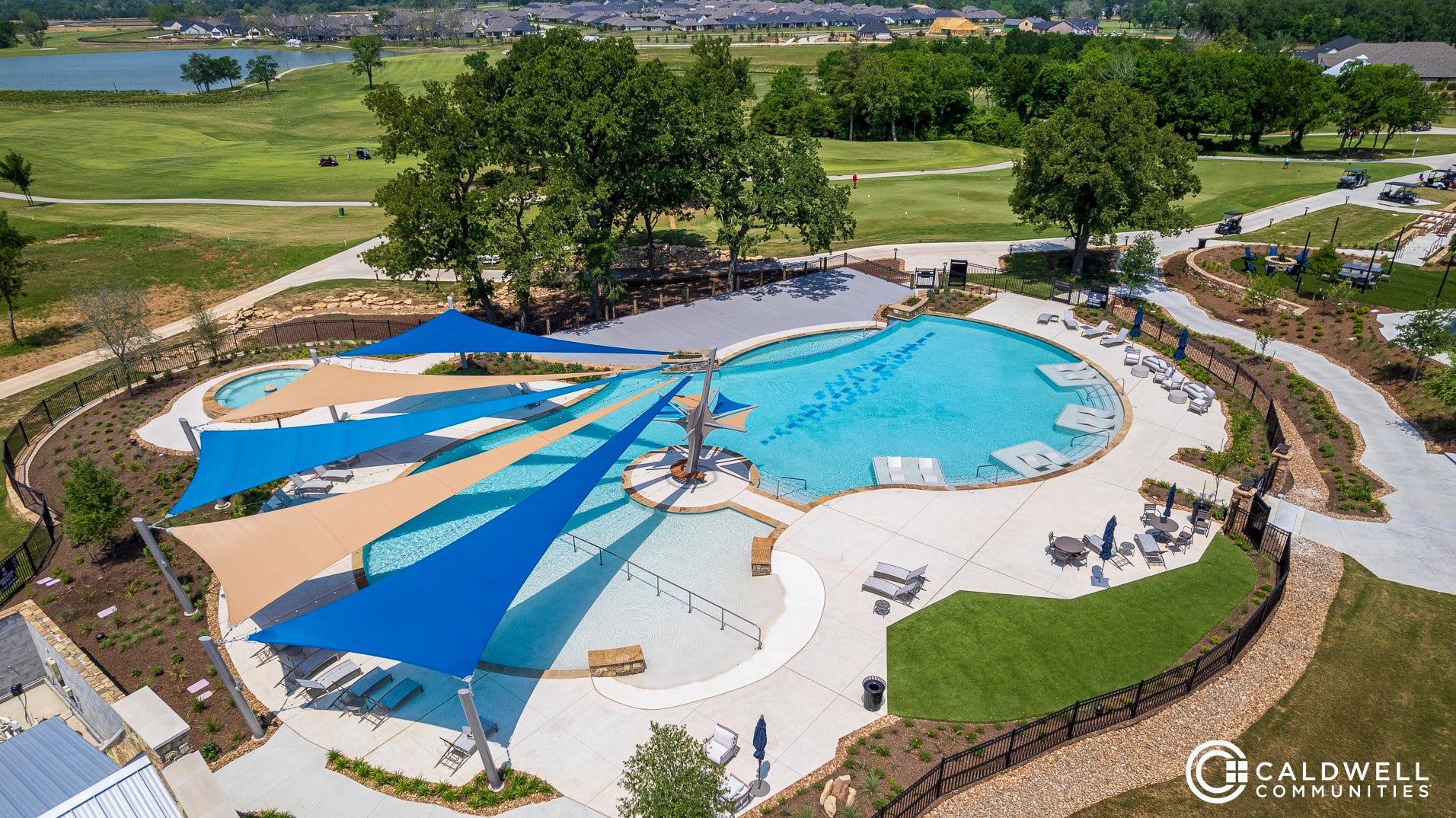 10213 Blanchard Court, Willis, TX 77318 A resort-style outdoor pool with lap lanes and a hot tub.