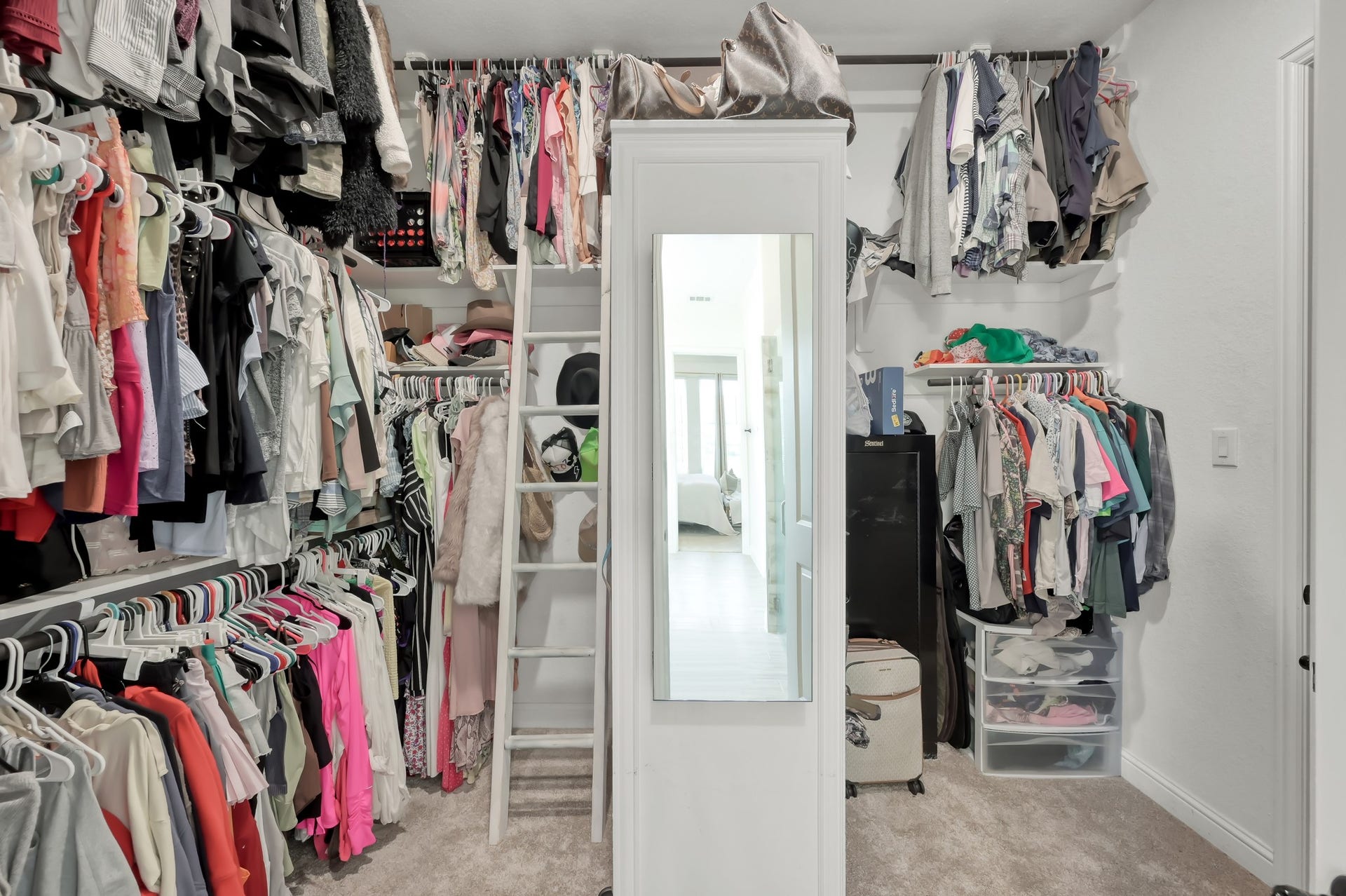 14626 Sterling Court, Willis, TX 77378 Primary closet that leads from bathroom into laundry room.