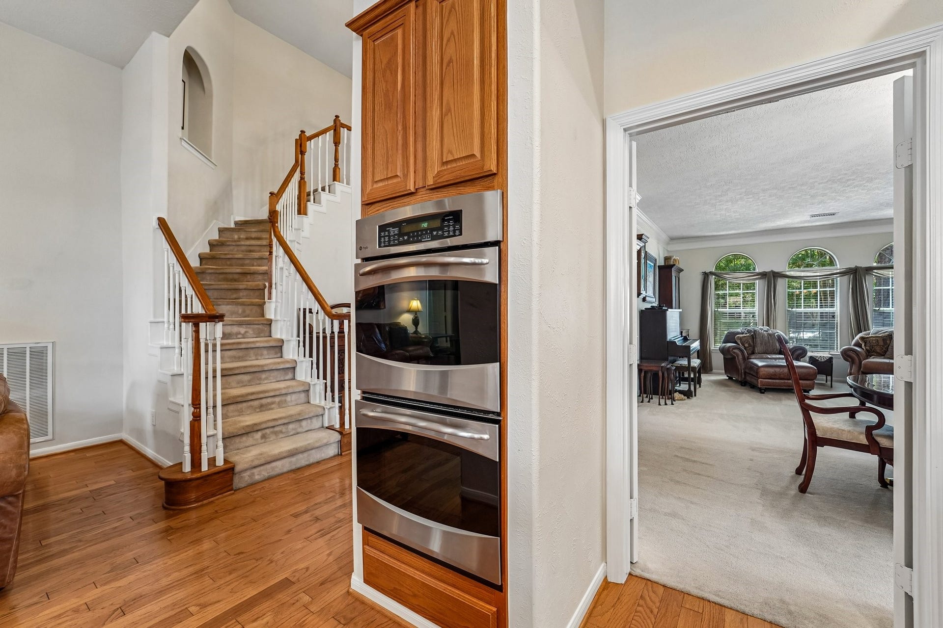 14 Serene Creek Place, The Woodlands, TX 77382 Kitchen is fitted with stainless steel appliances, include a double oven!
