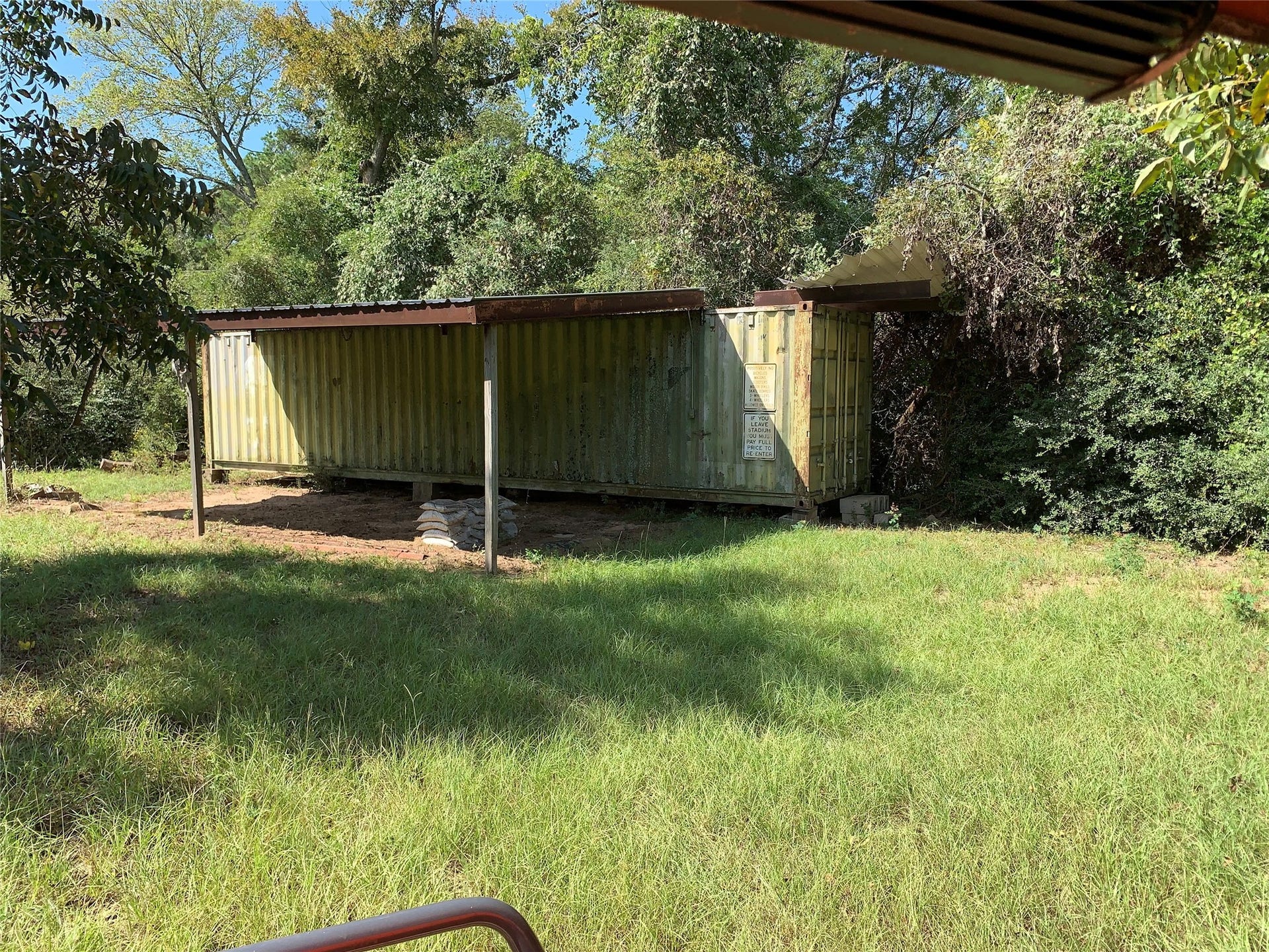 8x40 storage container with 15x30 awning for machine storage