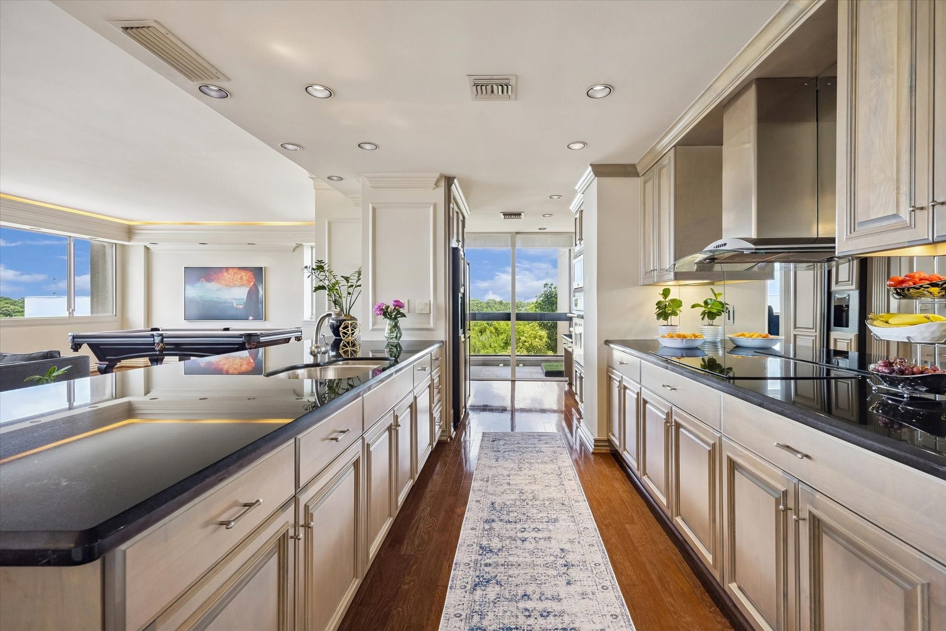 49 Briar Hollow Lane, #702, Houston, TX 77027 Galley view of the kitchen towards the second balcony.