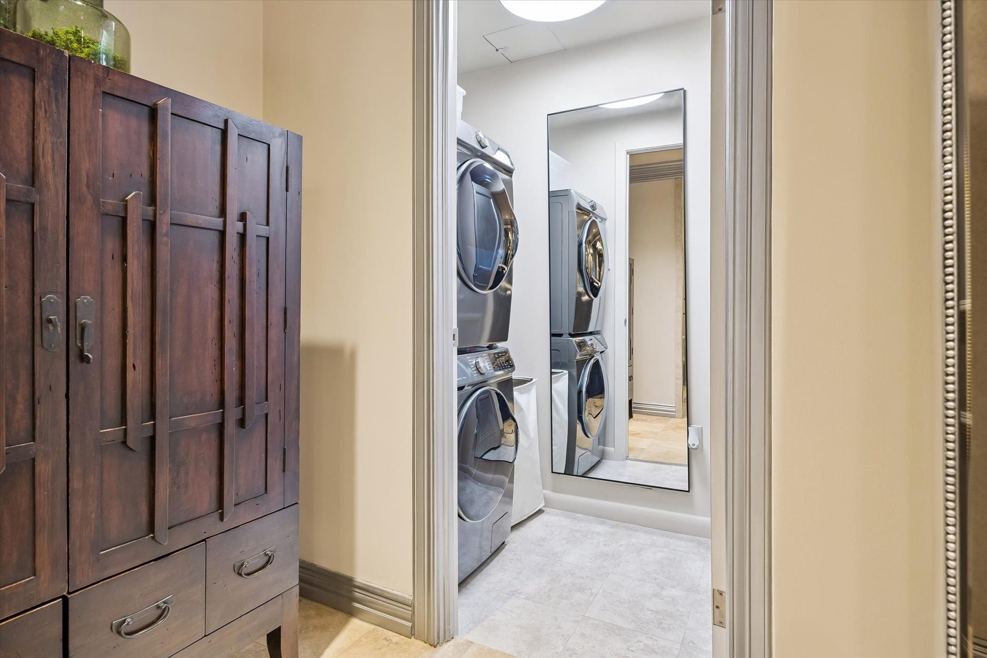 49 Briar Hollow Lane, #702, Houston, TX 77027 Utility closet with full sized, stacked washer and dryer.