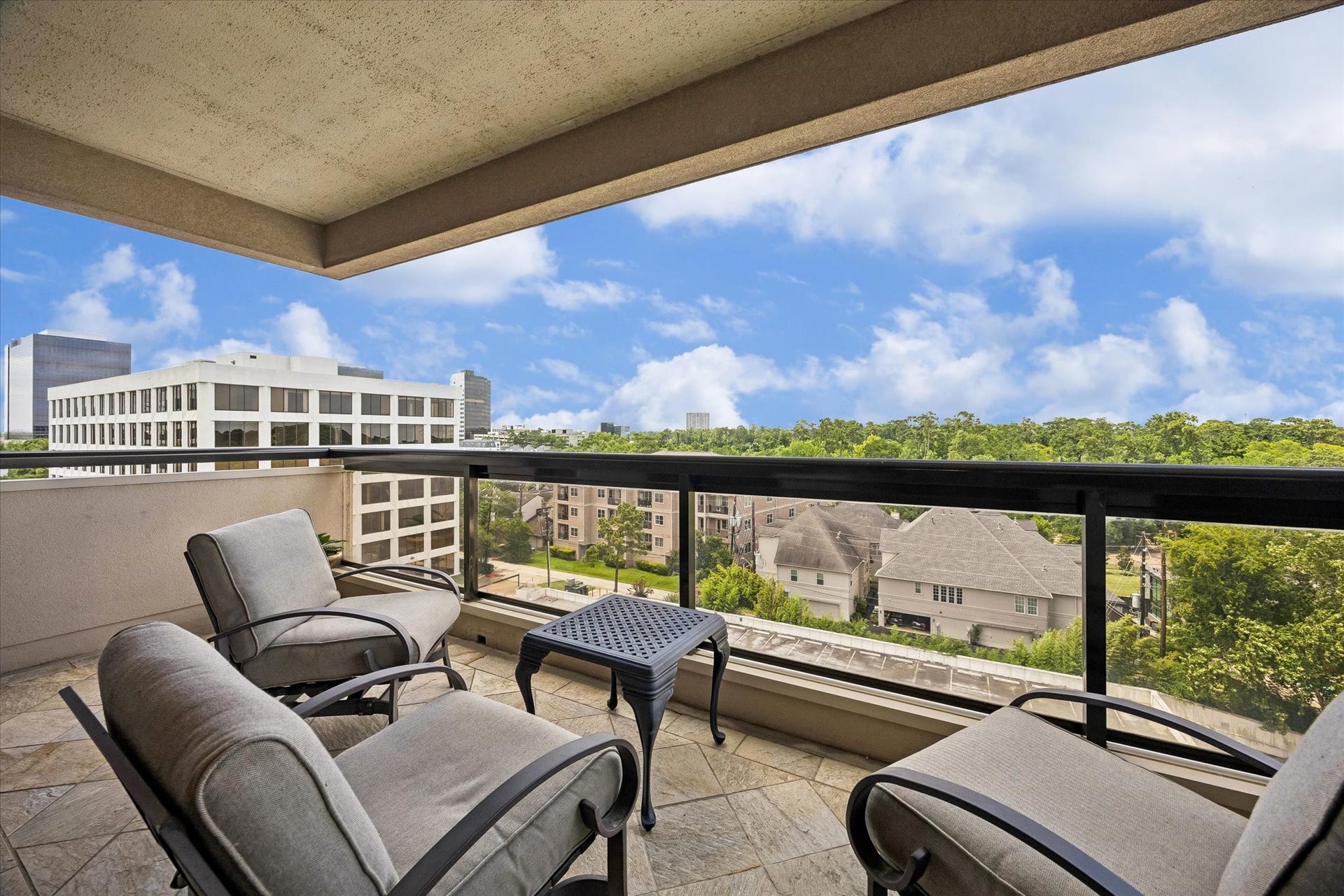 49 Briar Hollow Lane, #702, Houston, TX 77027 Large, covered balcony facing north with above the treetop views!