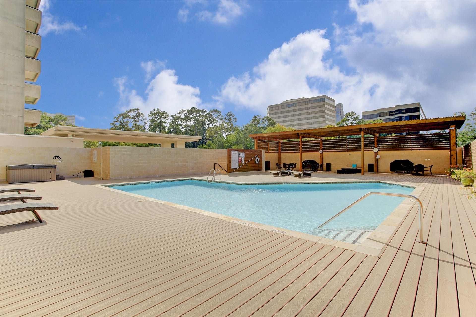 49 Briar Hollow Lane, #702, Houston, TX 77027 Pool area with covered pergola, hot tub and grills.