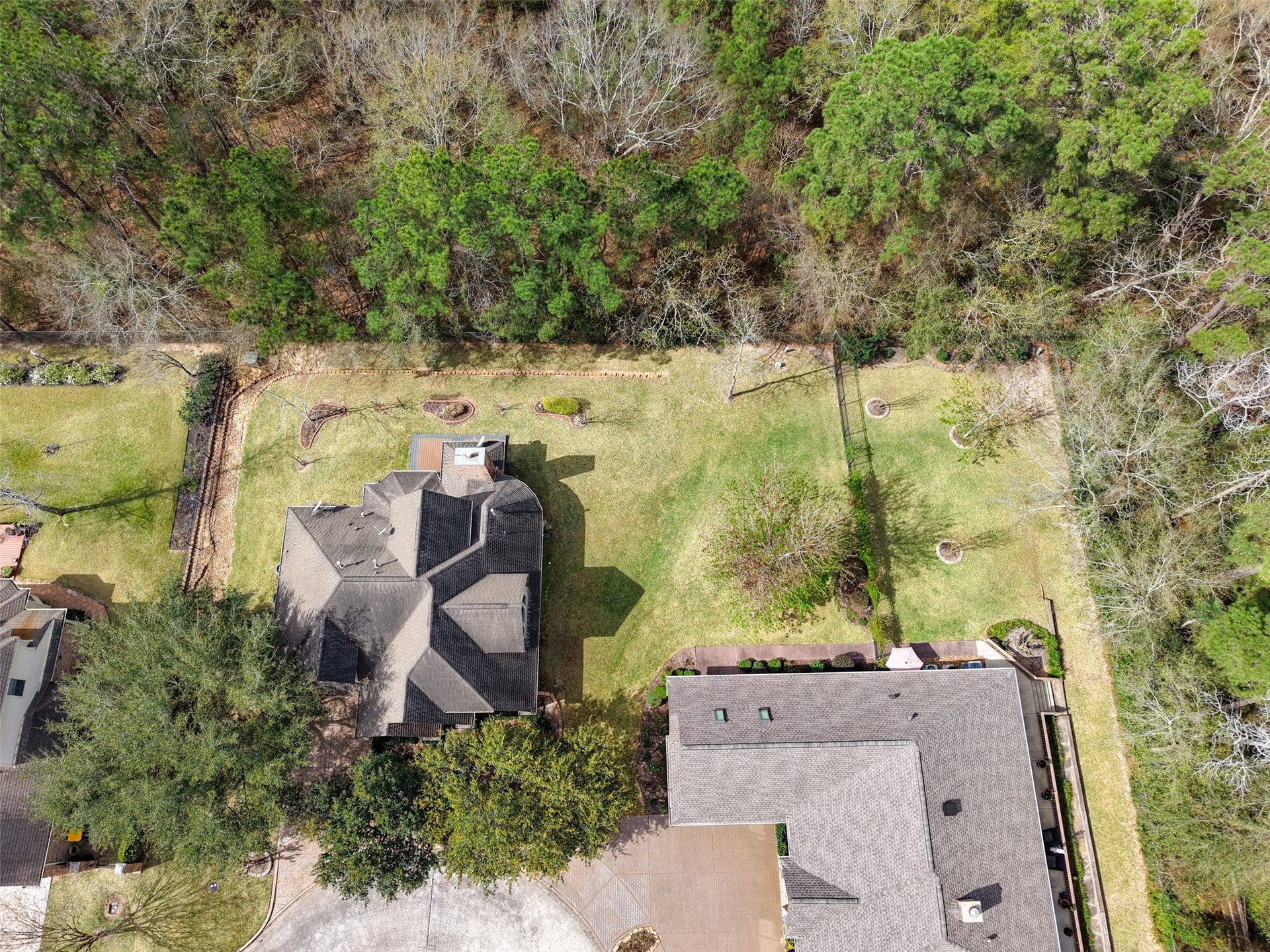 901 Longmire Road, #28, Conroe, TX 77304 Spacious property with a large, well-maintained lawn backing to natural reserve providing privacy. Ideal for those seeking a tranquil, natural setting.