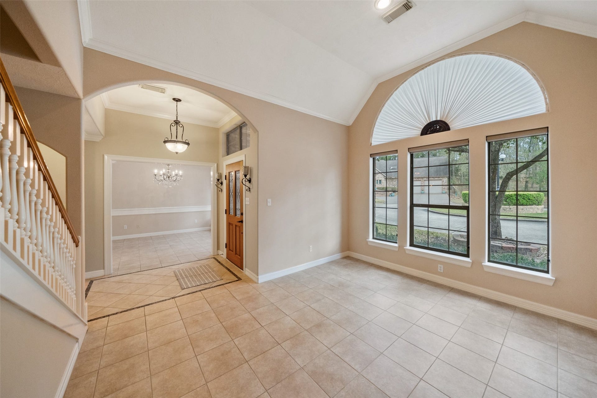 901 Longmire Road, #28, Conroe, TX 77304 Entryway leading to both the formals, dining and living. The formal living area is perfect for a home office space.