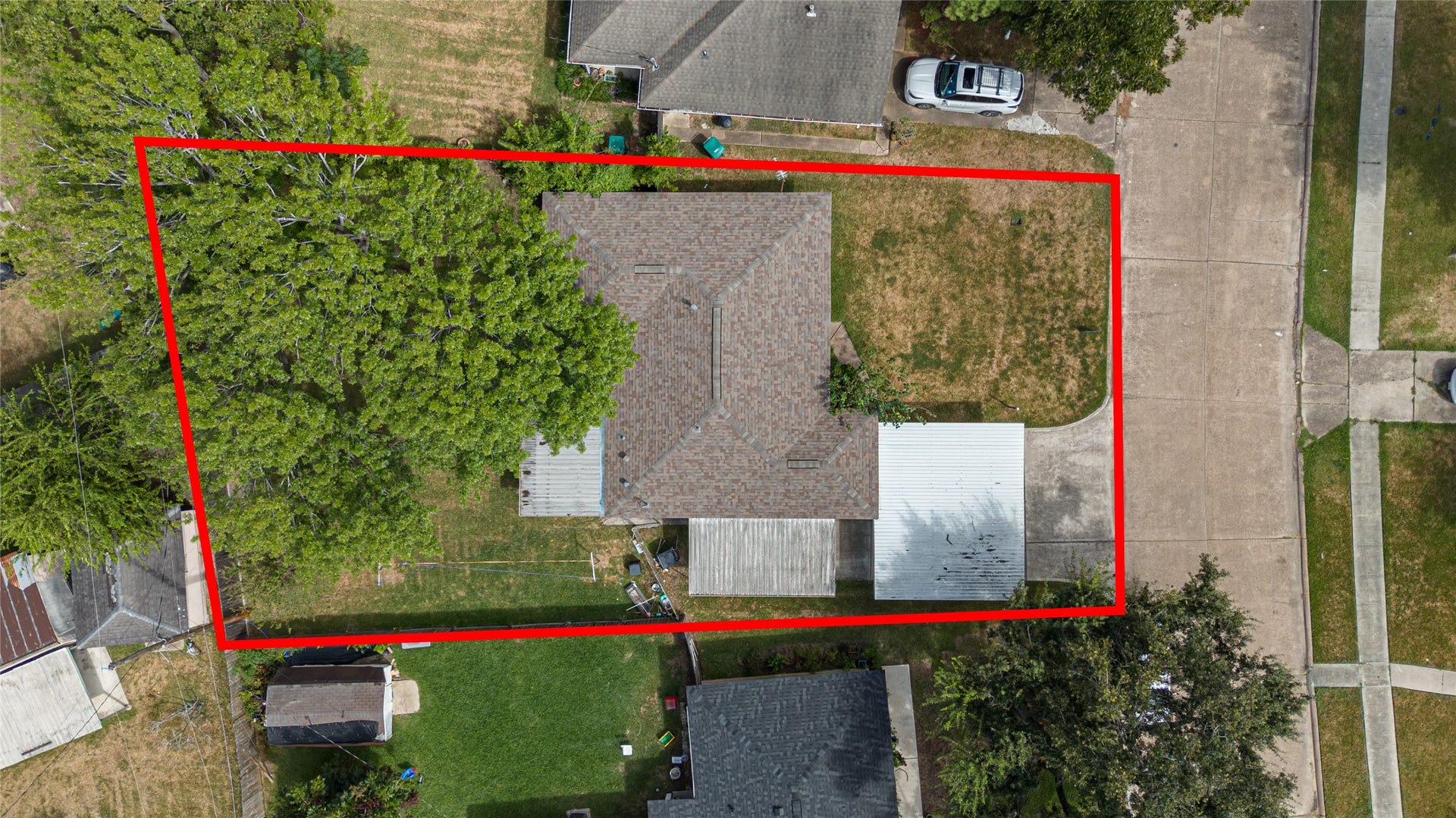 Charming single-story home on a spacious corner lot, featuring a large backyard with mature trees and ample outdoor space. Ideal for entertaining or expanding your living area.