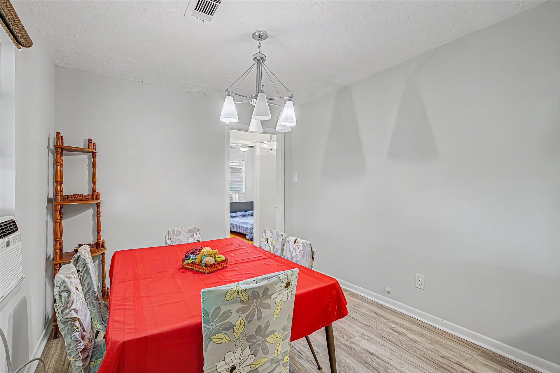 Bright dining area featuring a contemporary light fixture.