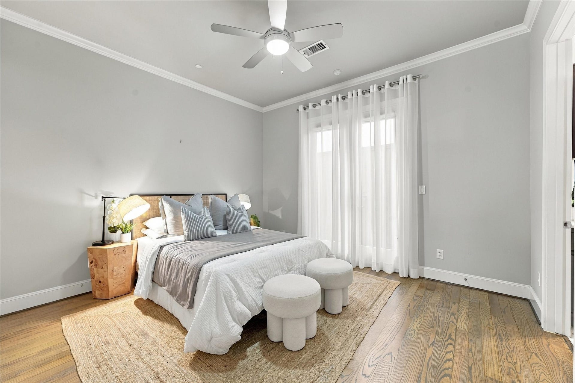 1306 Castle Court, Houston, TX 77006 First-floor guest suite with floor-to-ceiling sheers and wood floors