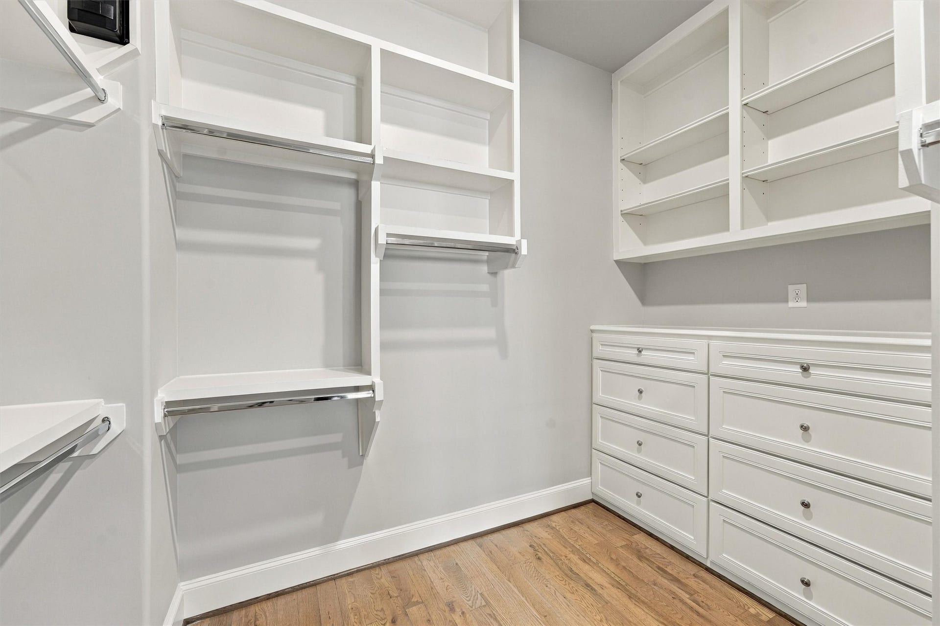 1306 Castle Court, Houston, TX 77006 Primary closet with custom built-ins, double hanging and a full bank of drawers