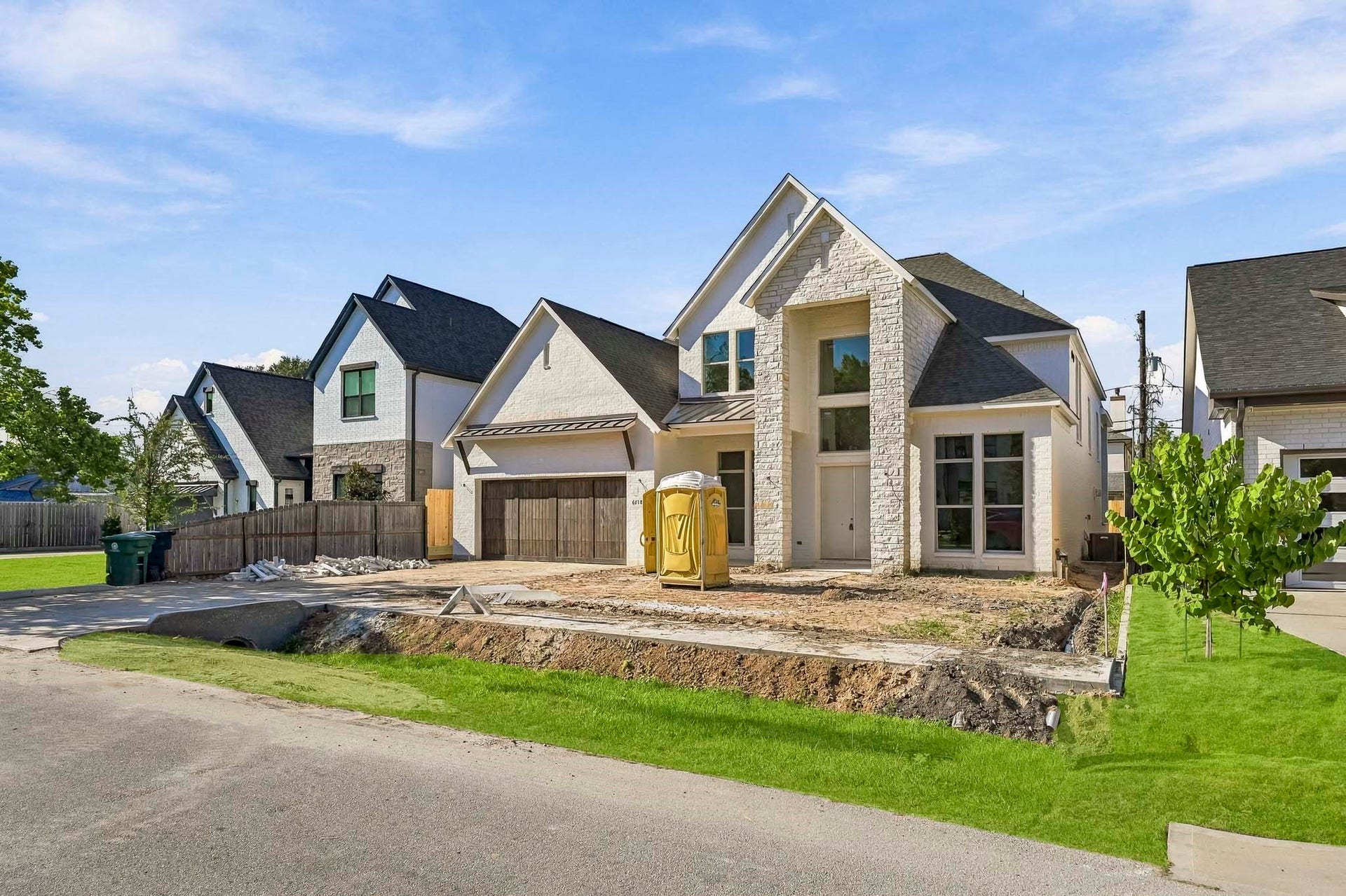 6618 Sivley Street, Hockley, TX 77055 Striking stone facade, large windows, and a oversized two-car garage!