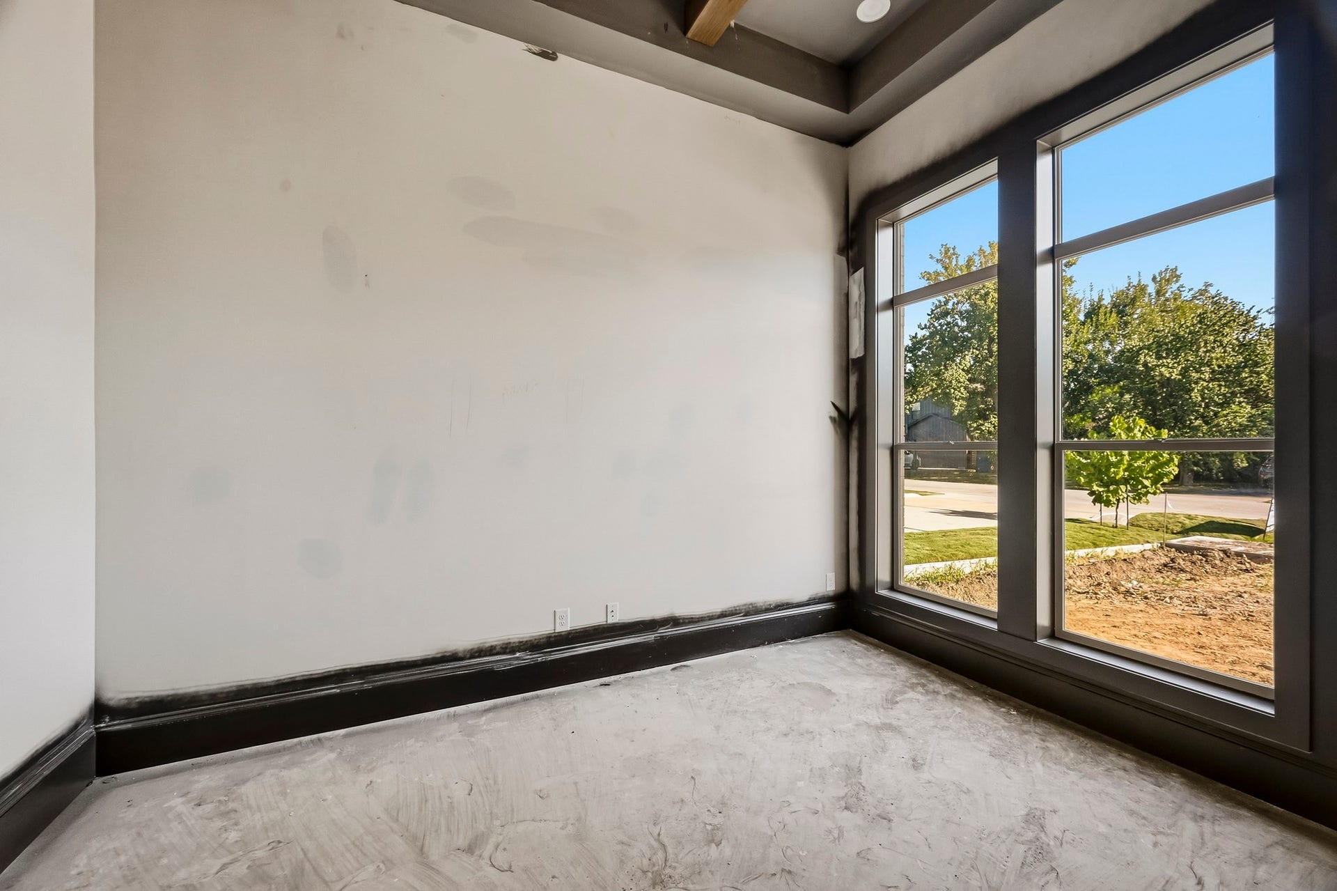 6618 Sivley Street, Hockley, TX 77055 Bright study with large windows offering plenty of natural light and a view of the outdoors, featuring sleek dark trim for a modern touch!