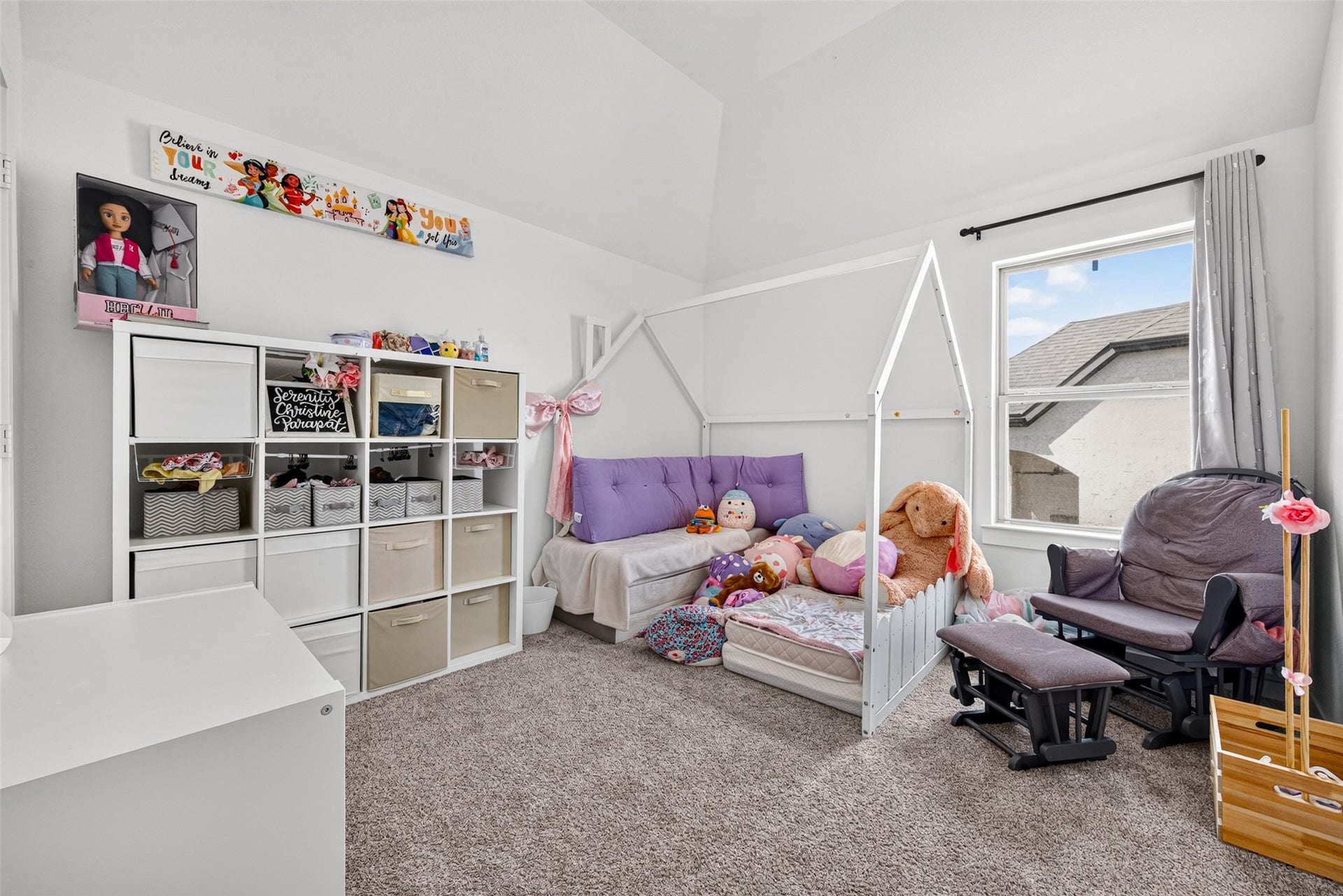 10114 Brush Way, Rosharon, TX 77583 Charming bedroom with a cozy bed, ample storage solutions, and a bright window that fills the space with natural light, perfect for play and relaxation.