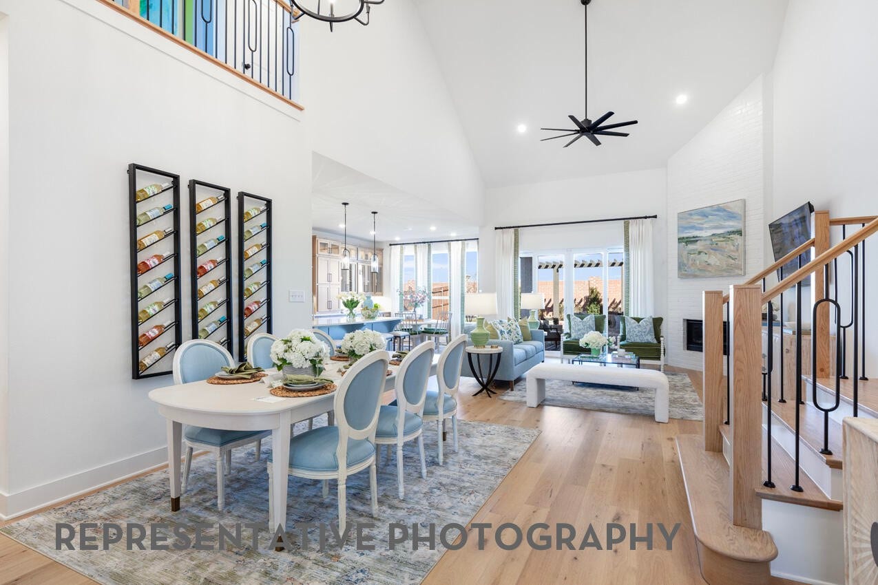 Open dining area with soaring ceilings and seamless flow into the main living spaces.