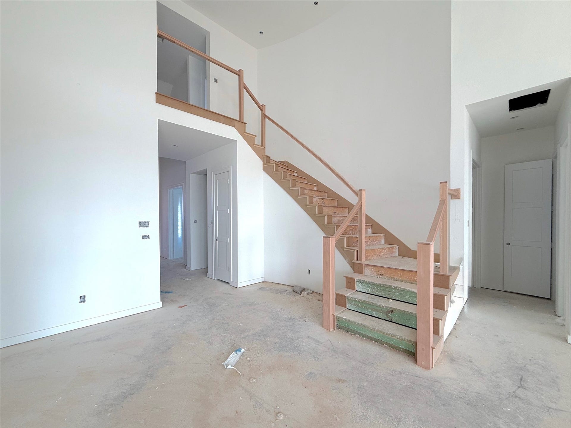 U shaped staircase gives the home the grand feel into the common areas