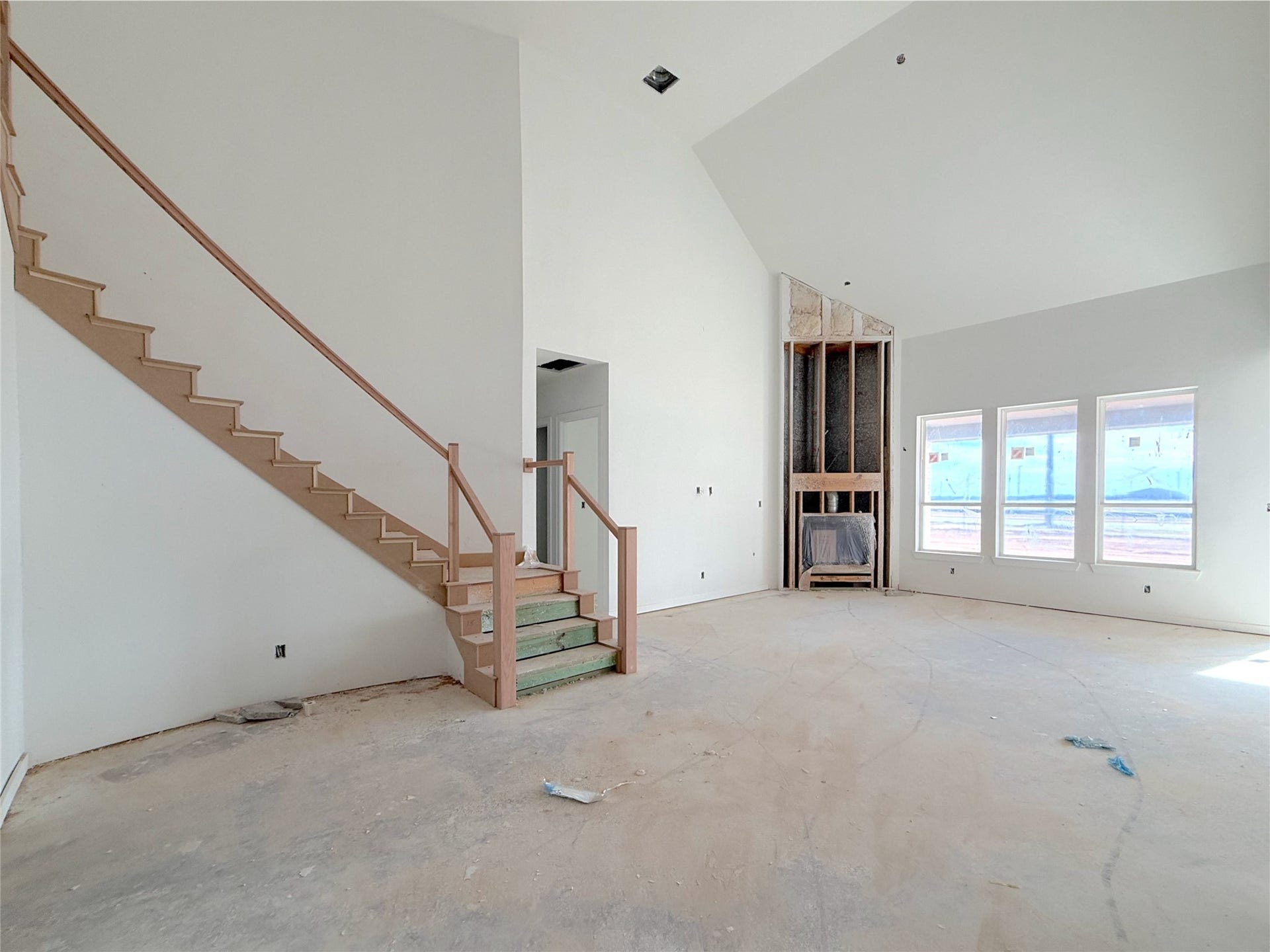 Seamless flow of the stairs into the dining and living areas.