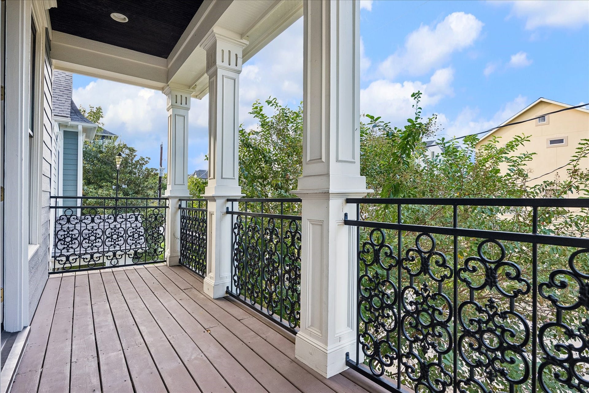 1332 W 21st Street, #B, Houston, TX 77008 Classic columns, ornamental iron railings, and a covered setting create a charming outdoor escape overlooking the neighborhood.