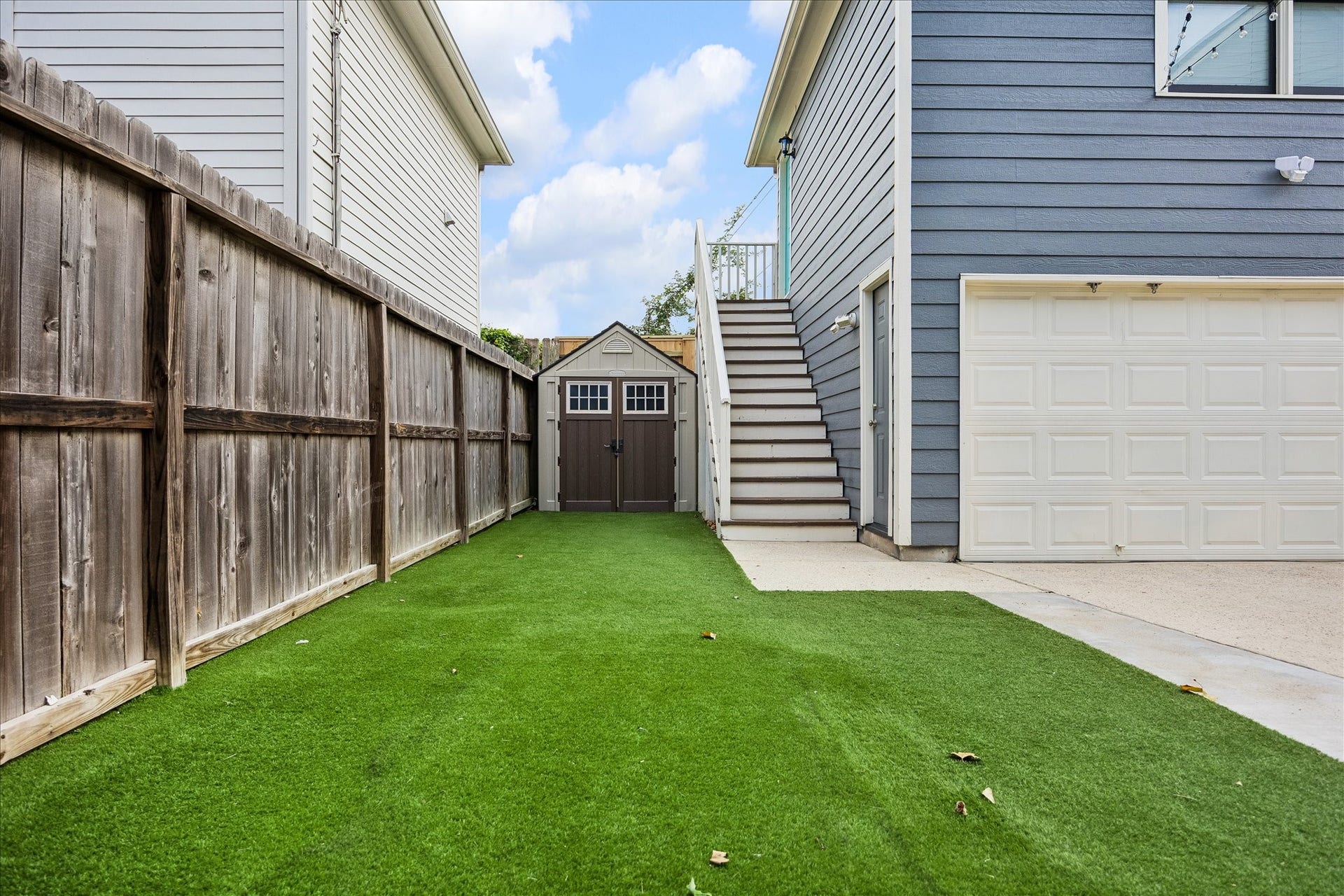 1332 W 21st Street, #B, Houston, TX 77008 A fenced outdoor space with low-maintenance turf, a garden shed, and easy access to the garage apartment.