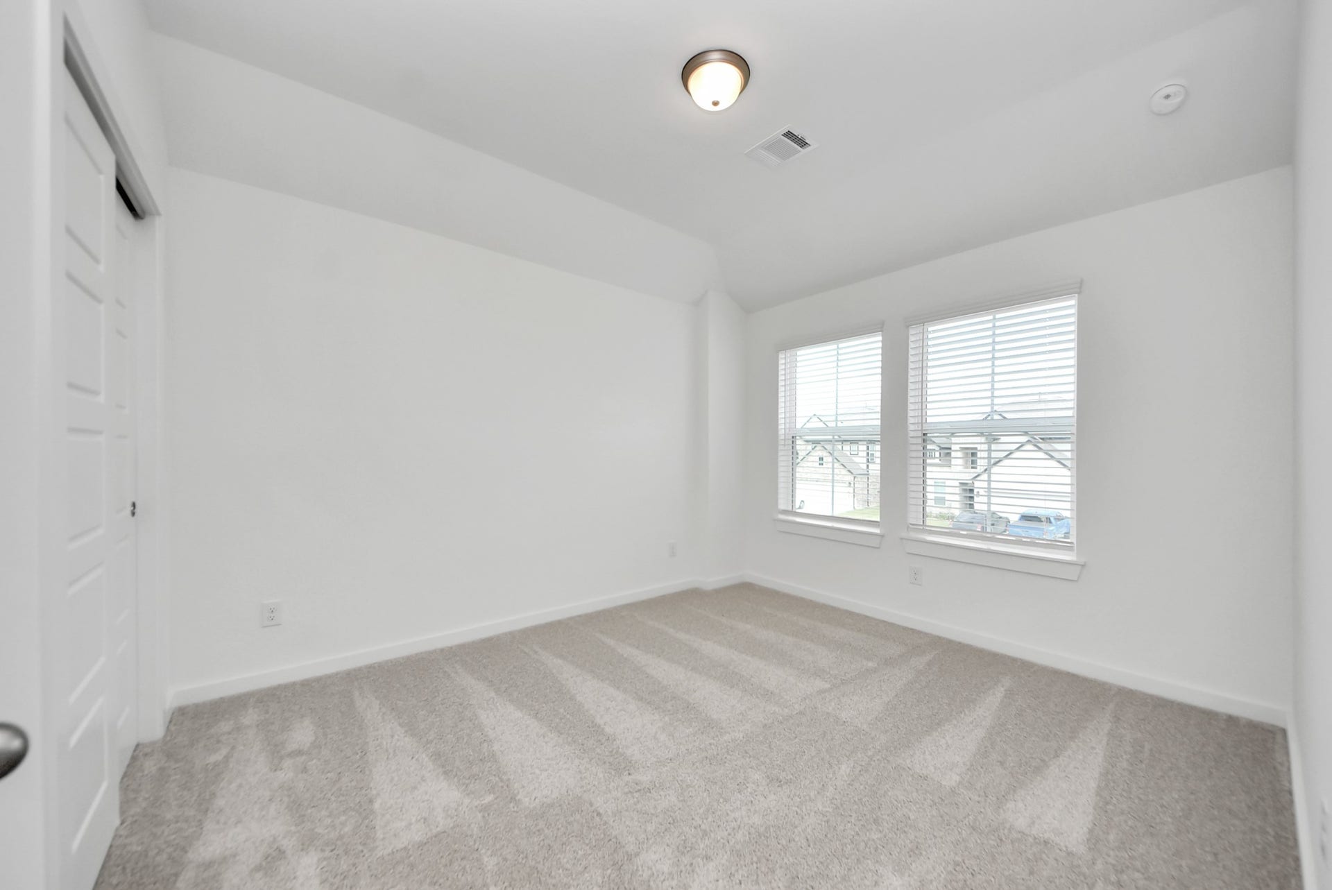 11119 Rose River Drive, Houston, TX 77044 Generously sized secondary bedrooms featuring spacious closets, soft and inviting carpeting underfoot, large windows allowing plenty of natural light, and the added touch of privacy blinds for your personal retreat.