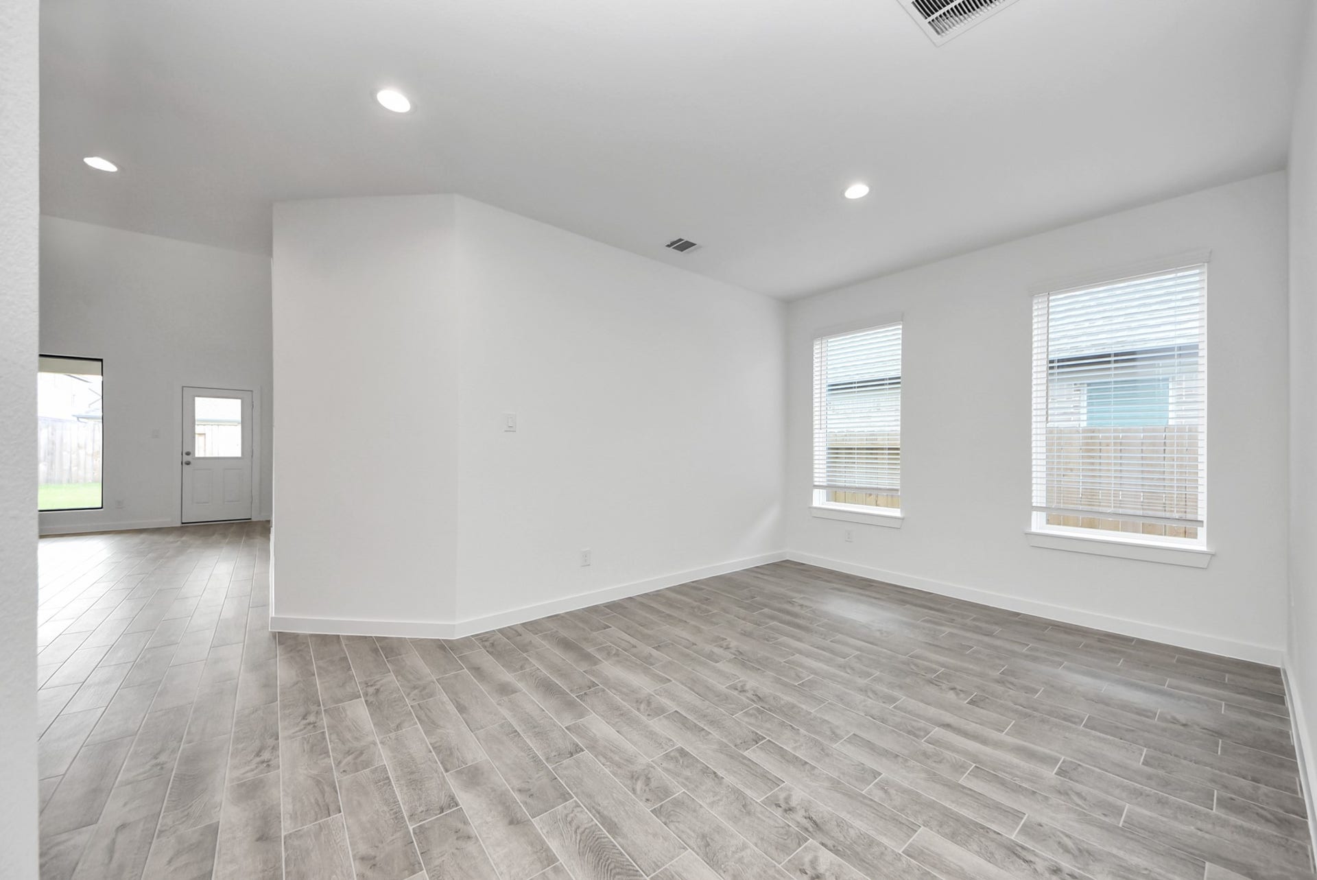 11119 Rose River Drive, Houston, TX 77044 Create lasting memories with your family and friends at the dining table! This expansive dining room showcases sophisticated flooring, custom paint, and seamlessly connects to the family room and kitchen, providing an open and inviting atmosphere