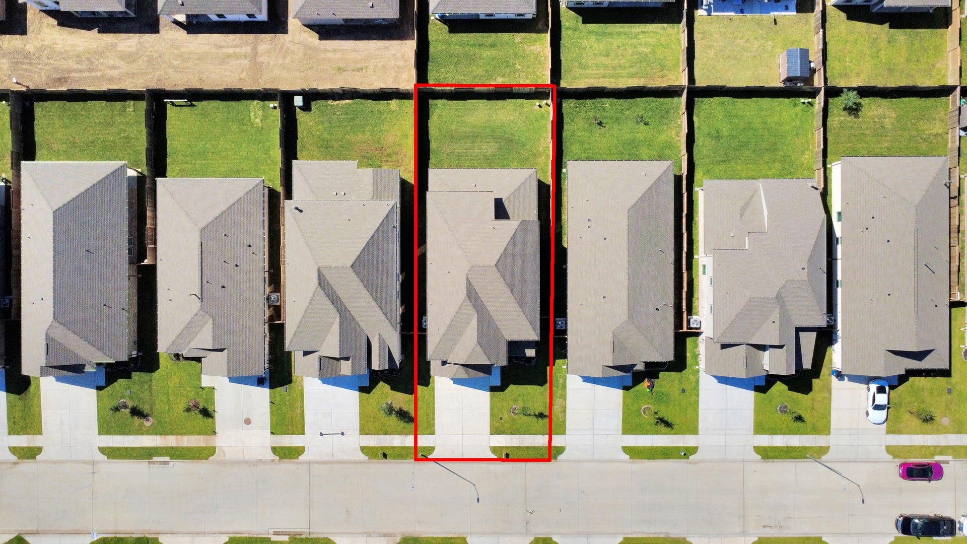 11119 Rose River Drive, Houston, TX 77044 An aerial view of a spacious subdivision lot, highlighting a well-maintained yard and a fully fenced perimeter, offering both privacy and expansive outdoor space.