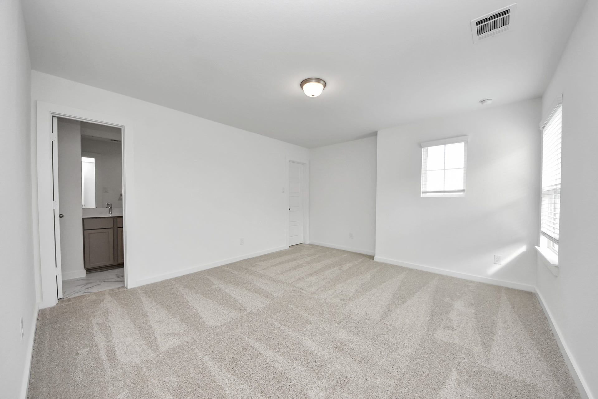 11119 Rose River Drive, Houston, TX 77044 Generously sized secondary bedrooms featuring spacious closets, soft and inviting carpeting underfoot, large windows allowing plenty of natural light, and the added touch of privacy blinds for your personal retreat.