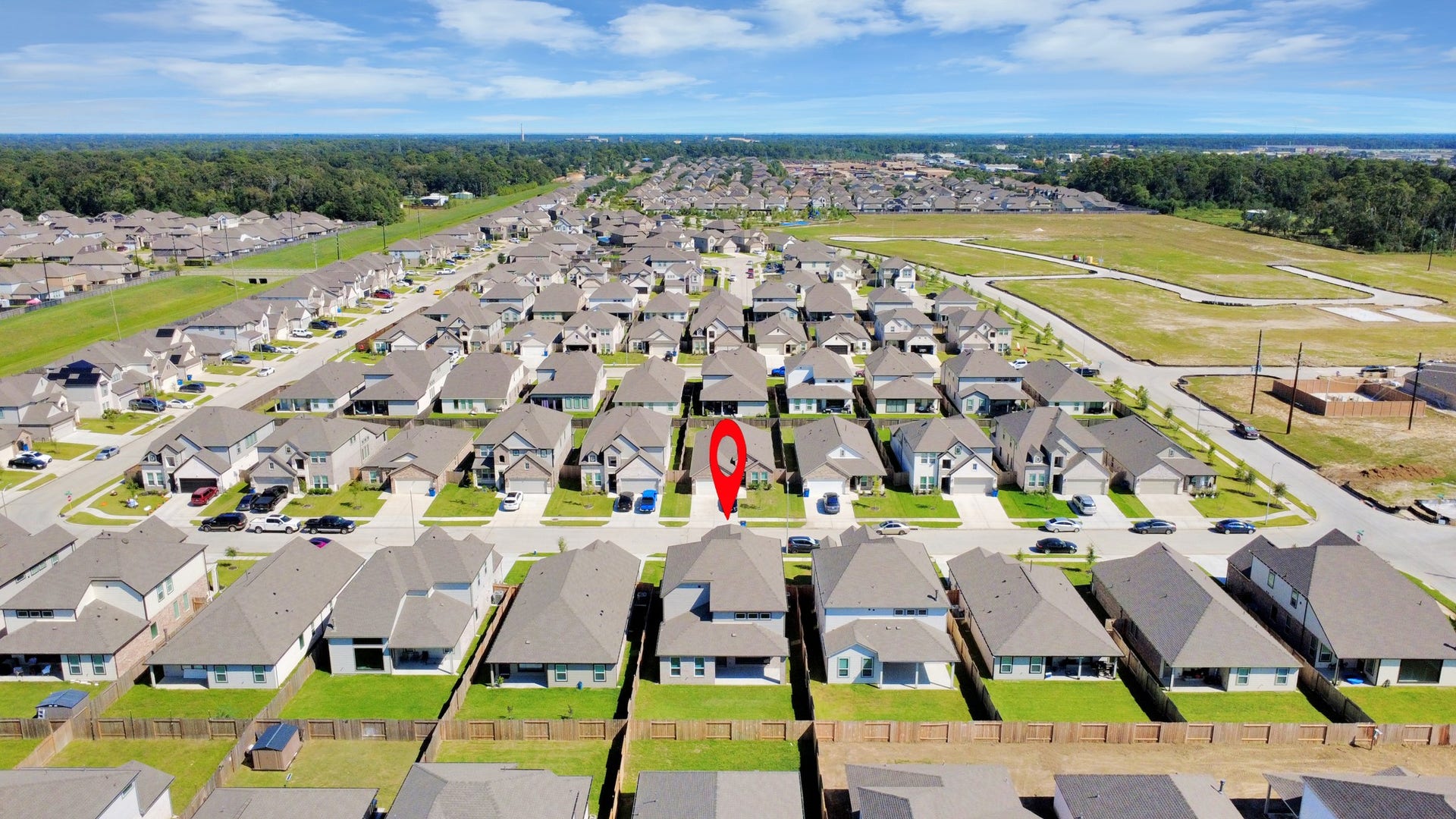 11119 Rose River Drive, Houston, TX 77044 An aerial view of a spacious subdivision lot, highlighting a well-maintained yard and a fully fenced perimeter, offering both privacy and expansive outdoor space.