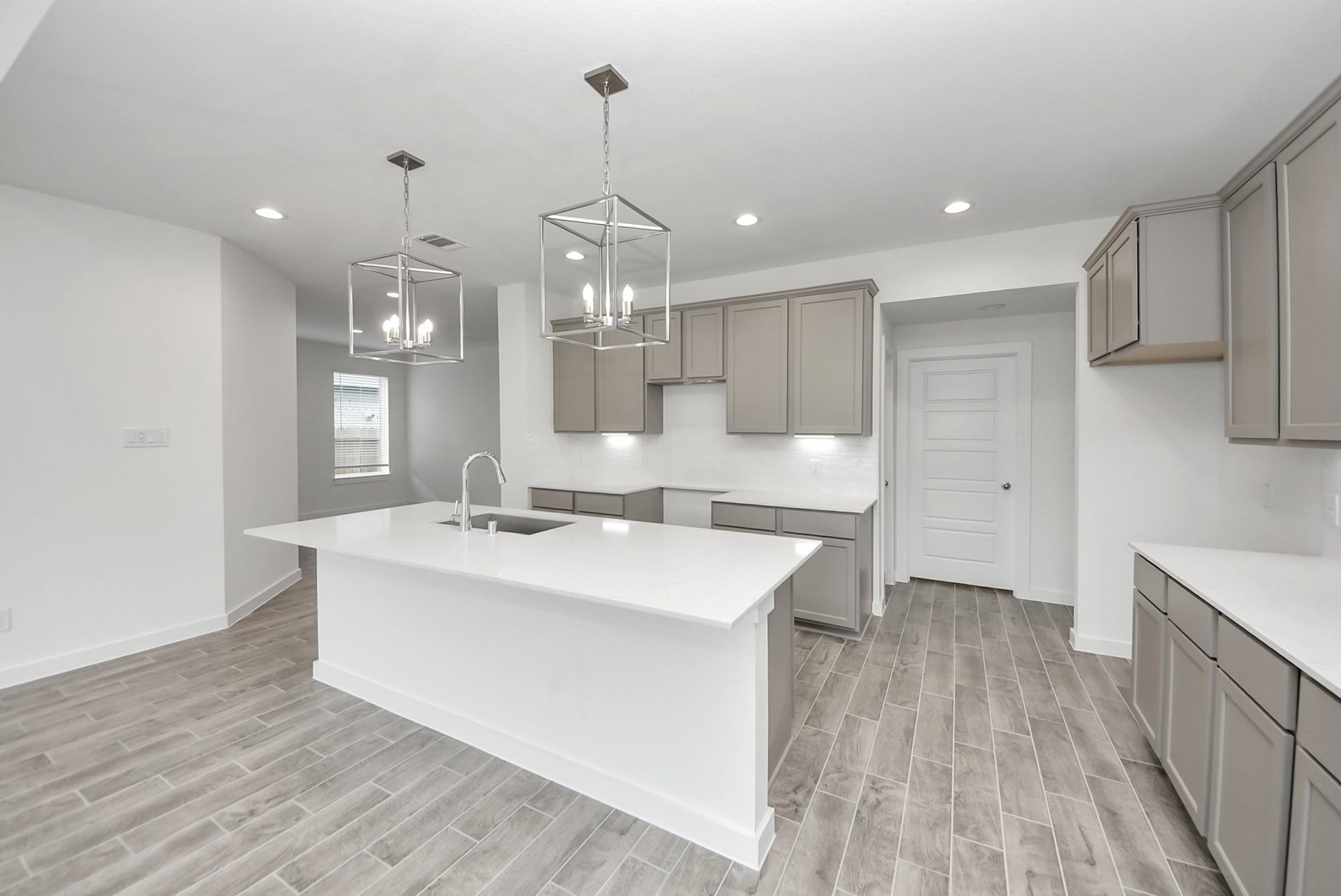 11119 Rose River Drive, Houston, TX 77044 The kitchen is a culinary haven, featuring granite countertops, a tile backsplash, stainless steel appliances, 42 upper cabinets, and undercabinet lighting.