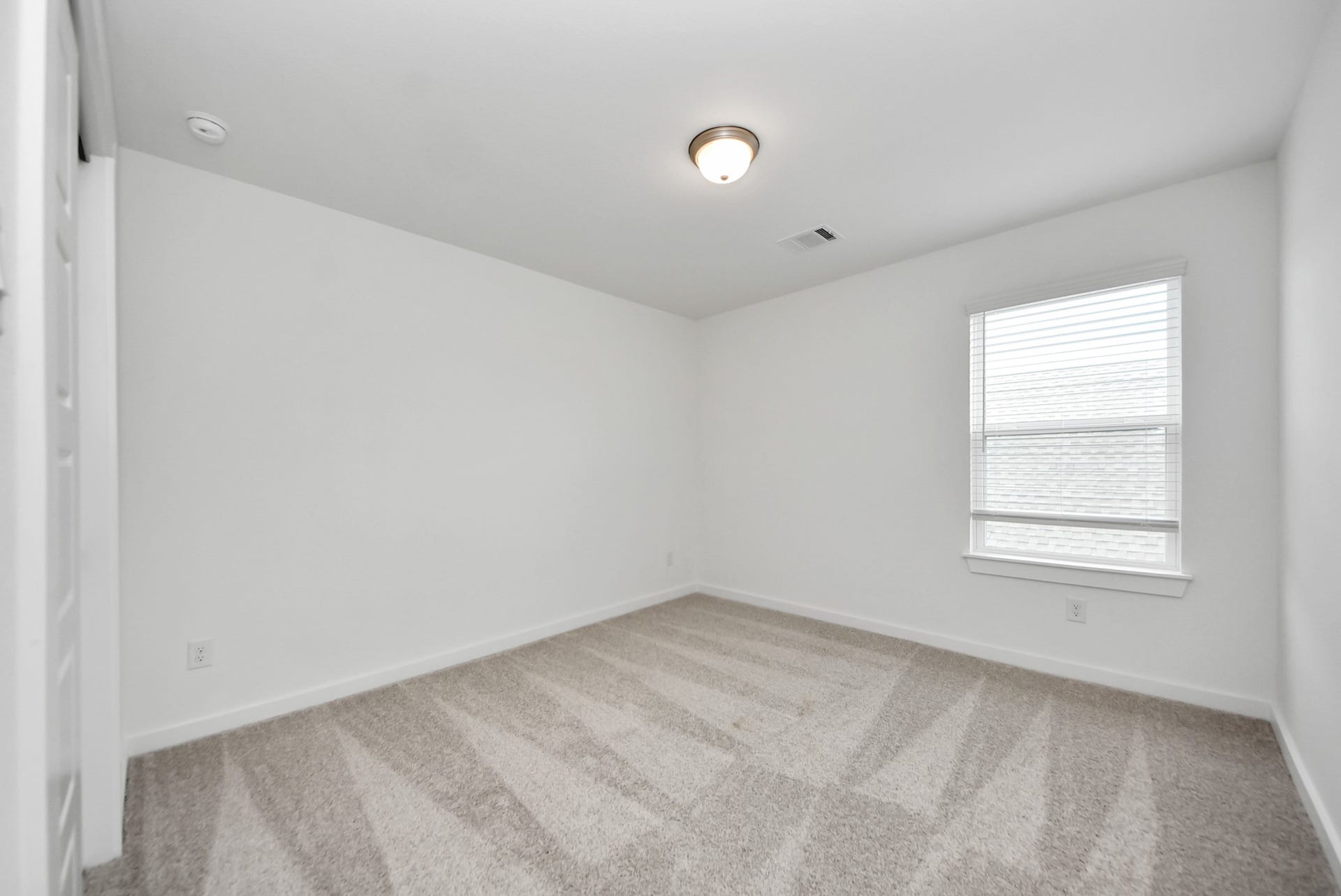 11119 Rose River Drive, Houston, TX 77044 Generously sized secondary bedrooms featuring spacious closets, soft and inviting carpeting underfoot, large windows allowing plenty of natural light, and the added touch of privacy blinds for your personal retreat.