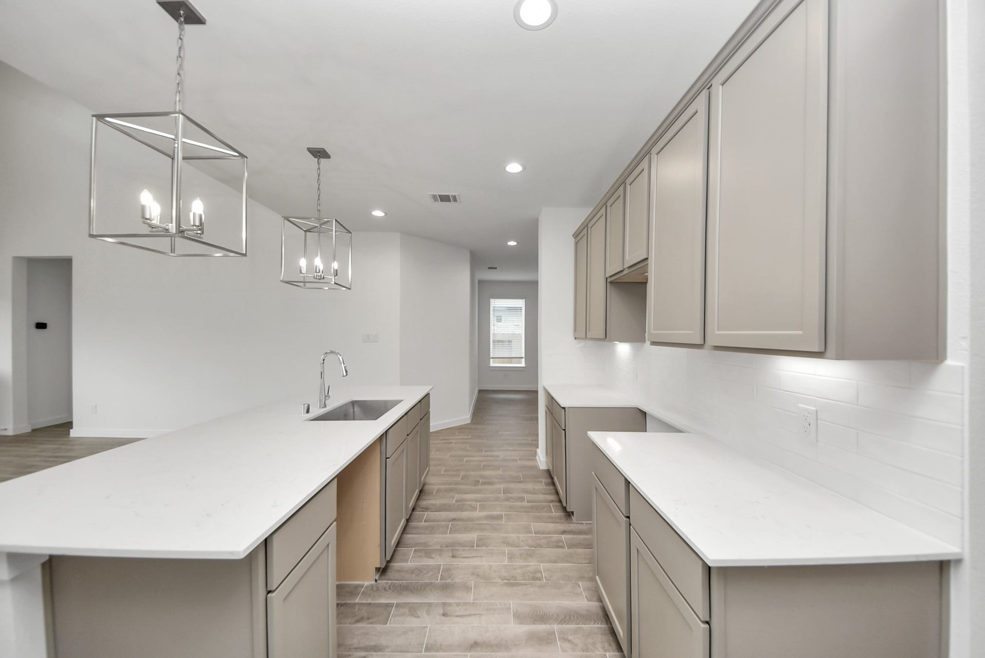 11119 Rose River Drive, Houston, TX 77044 The open concept effortlessly connects the kitchen to the expansive family room, forming a perfect hub for gatherings. This seamless flow creates an inviting space where cooking and socializing come together harmoniously.