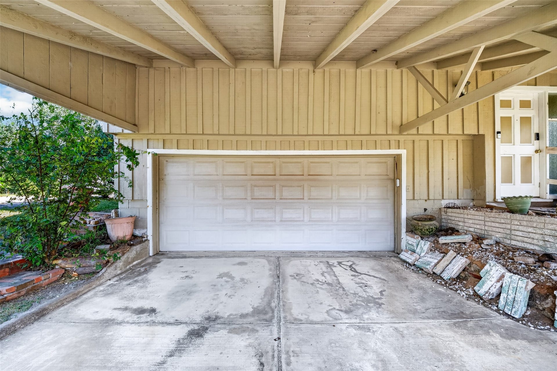Spacious two car garage with carport cover as well.